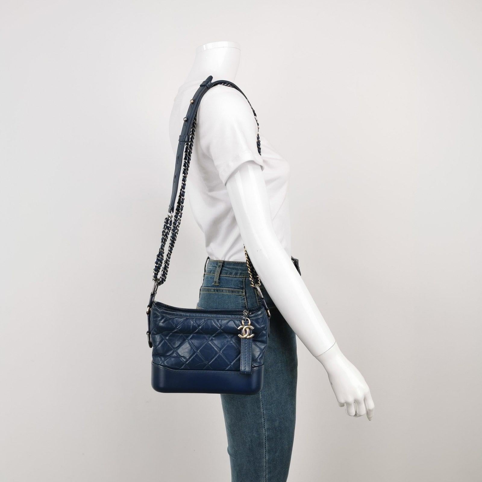 Chanel Gabrielle Hobo 2016 Navy Leather Small Crossbody Bag These are professional photos of the actual bag offered by Luxbags. 
 
 CONDITION: VERY GOOD This preloved authentic Chanel Gabrielle bag is in very good condition with signs of use. There