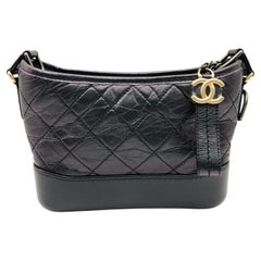 Chanel Gabrielle Hobo Bag Iridescent Purple Aged Calfskin Black Leather Charm