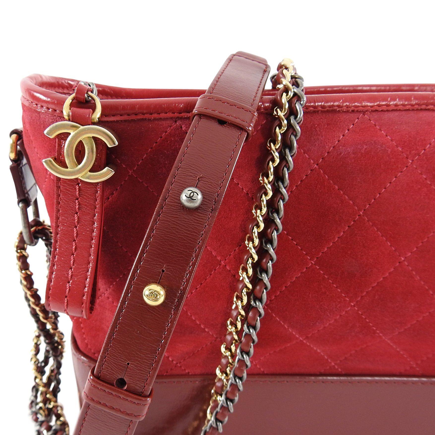 Chanel 2018 Red Medium Suede Gabrielle Bag. Original retail $4600 USD. 
Purchased from Neiman Marcus
Structured red base with quilted red suede upper.
Tricolor chain metal hardware with goldtone cc zipper pull. 
Date code 24-series 
Measures 11 x