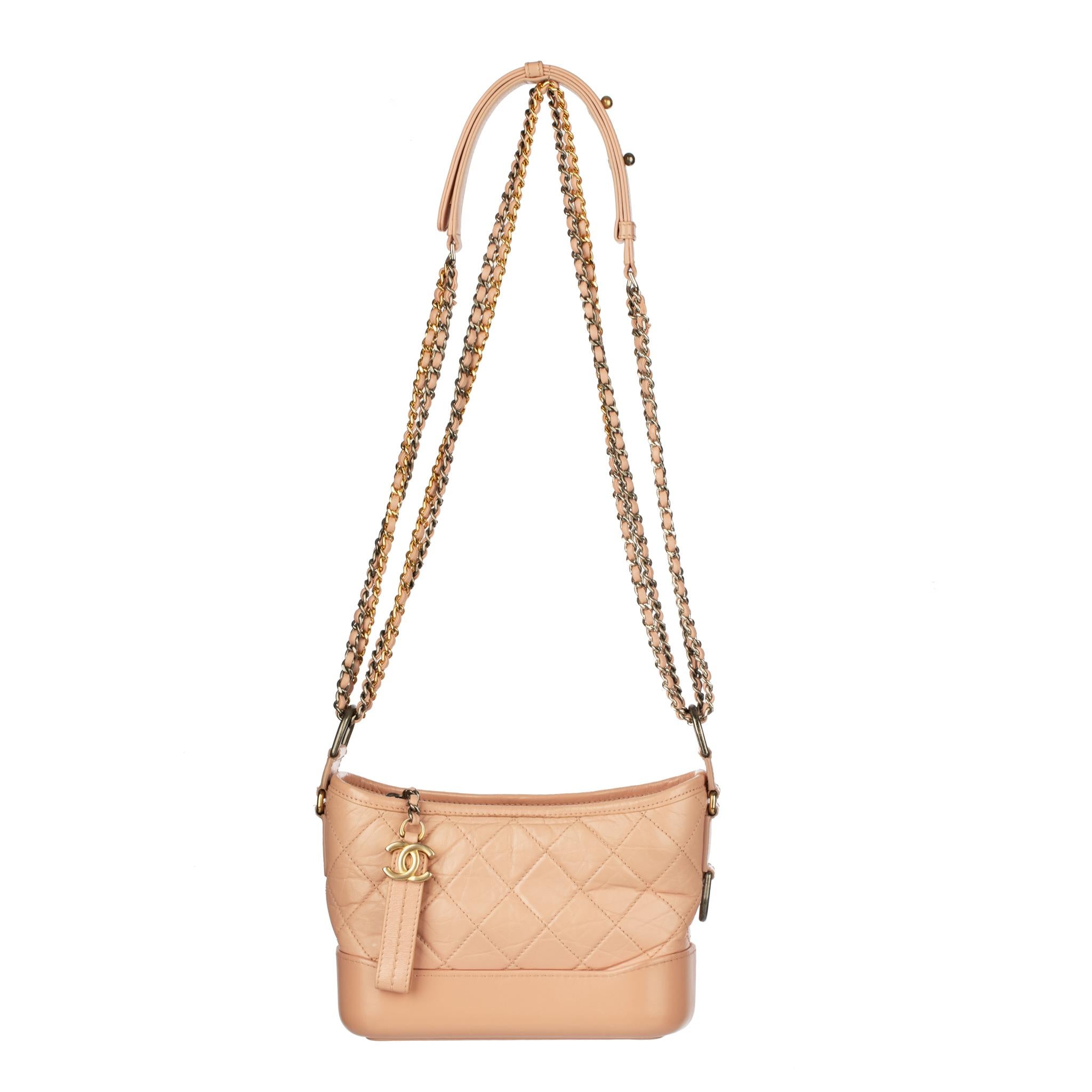 Brand: Chanel
Product: Small Chanel Gabrielle
Size: 21.6 l x 17.1 h x 7.6 d cm
Strap Drop: 40.6 - 69.9 cm
Colour: Dusty Pink
Material: Grained Calfskin Leather
Hardware: Gold & Silver Tone
Series: 27  2019

Condition:

Excellent: The product is in