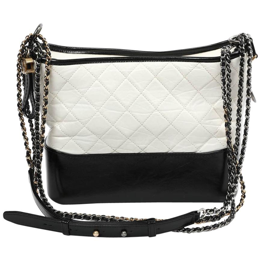 A Chanel Gabrielle two-tone black and white leather bucket bag, sold at  auction on 27th October