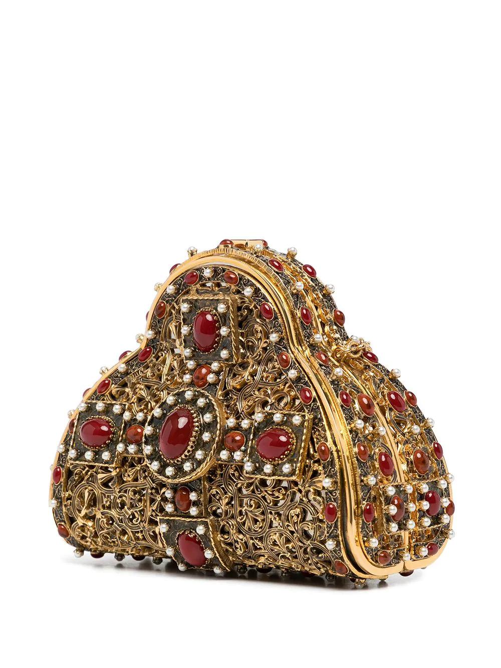 Based on Coco Chanel's flirtation with Russian-Parisian émigré society in the 1910s and 1920s, this pre-owned clutch bag featured on the pre-fall Metiers d'Art Paris-Moscow runway in 2009. Crafted from a 24k gold plated metal construction, this