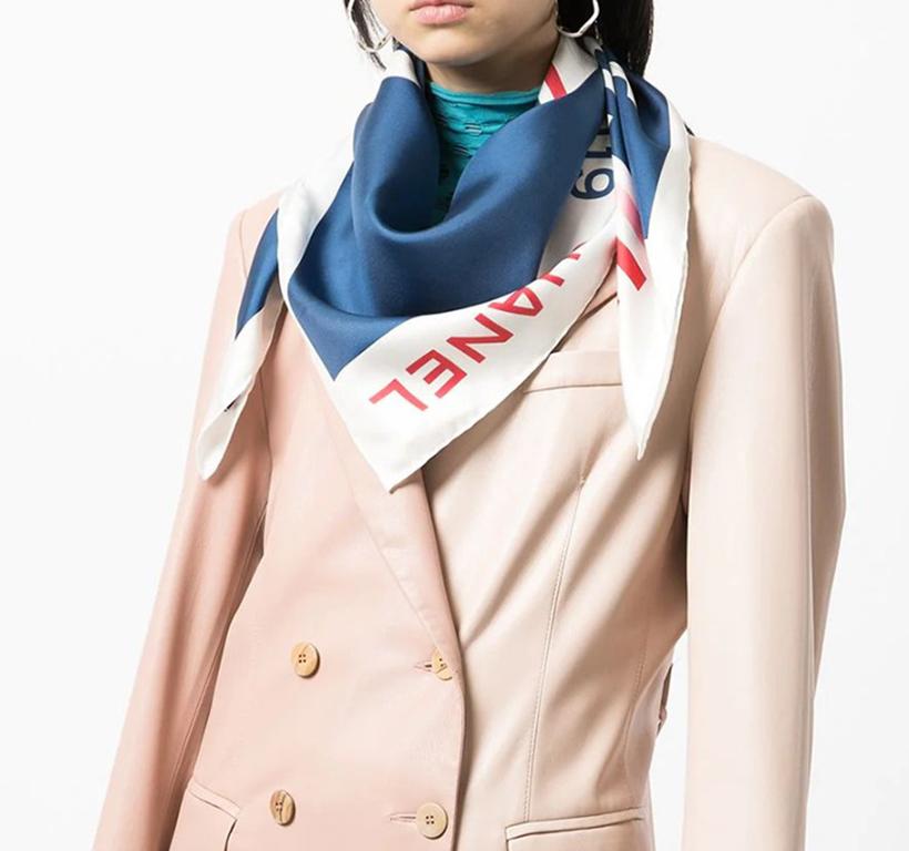 Crafted in France from the purest silk, this pre-owned Chanel silk features a Geometric Cruise collection design in blues, reds and pinks. Delicately bordered with a classic pipe trim, wear knotted around the neck or tied in your hair.
