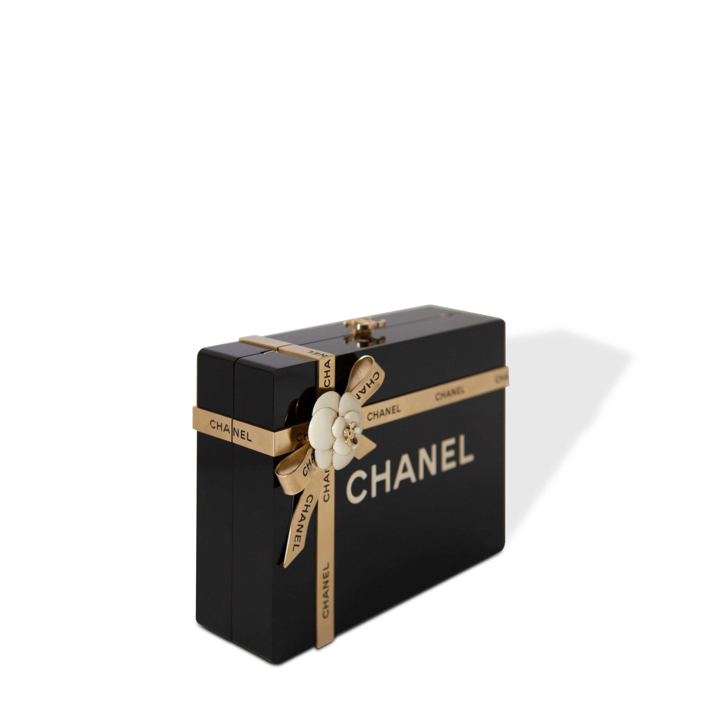 Chanel Black Plexiglass Gift Box Minaudière Gold Hardware, 2017.

The interior is lined in black leather.
Includes authenticity card, and dust bag.

This pre-owned Chanel® item has been authenticated by our in-house trained professionals. Chanel is