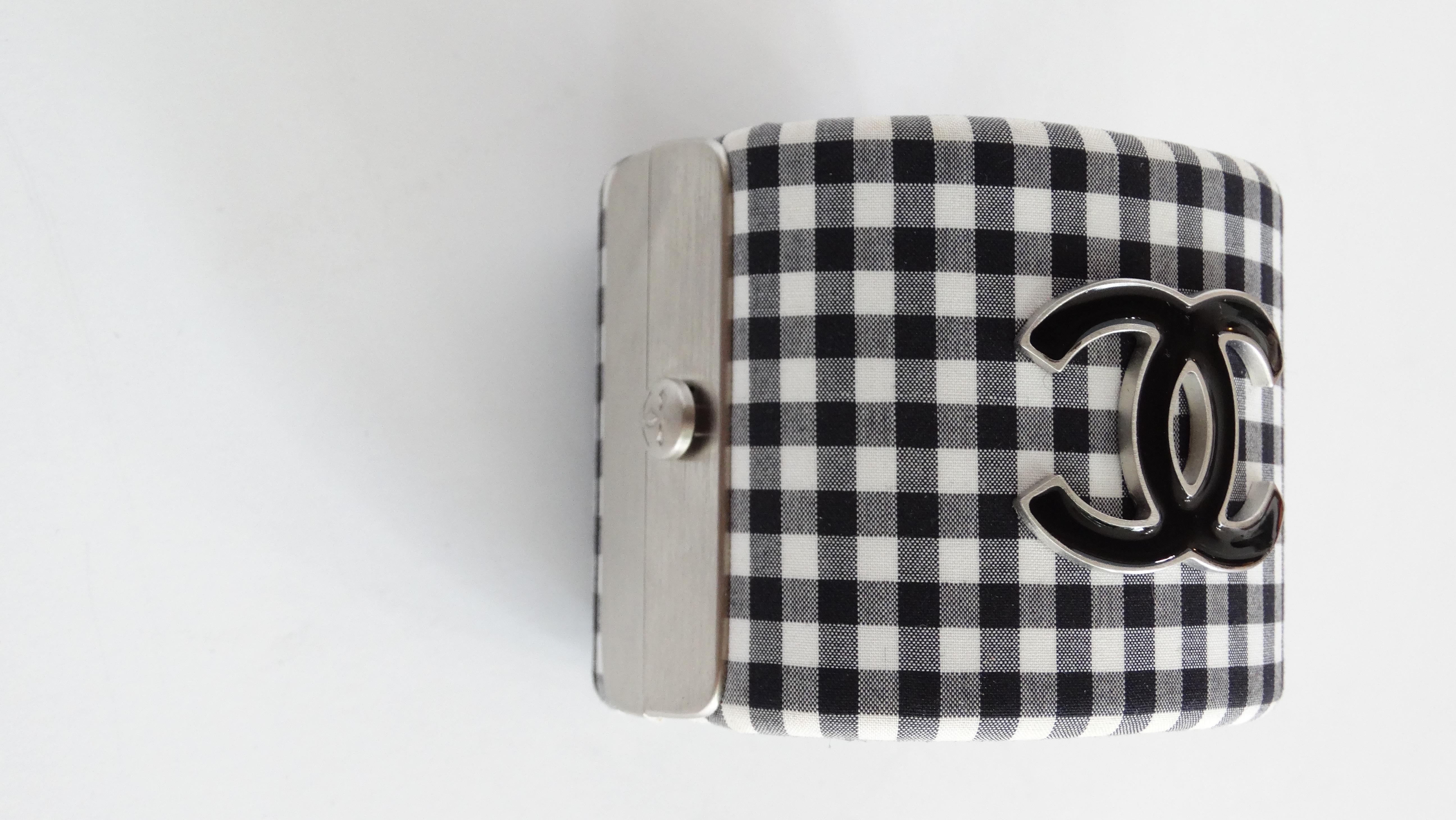 2011 CHANEL Gingham Resin CC Cuff Black White. This fabric covered wide cuff bracelet features a check gingham print with a prominent resin CC design at the front. This is an excellent cuff bracelet with the timeless style only from Chanel!