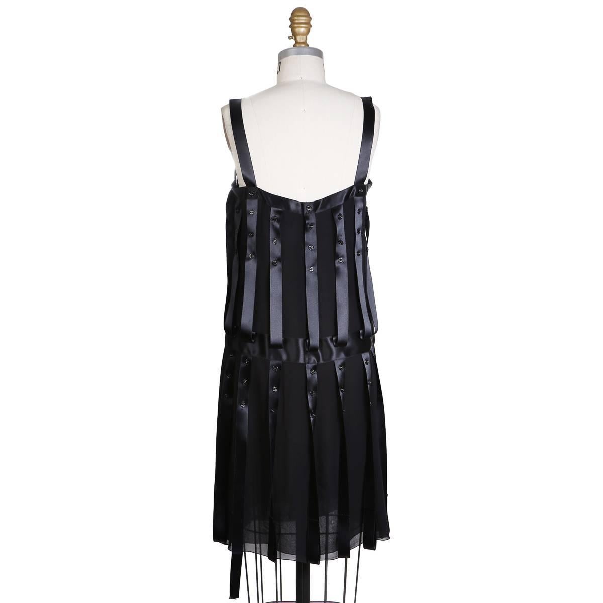 Shift dress from Chanel for the F/W RTW 2003 collection
Black satin trims with snap details
100% silk
Condition: Excellent
Size/Measurements:
Size 38
32