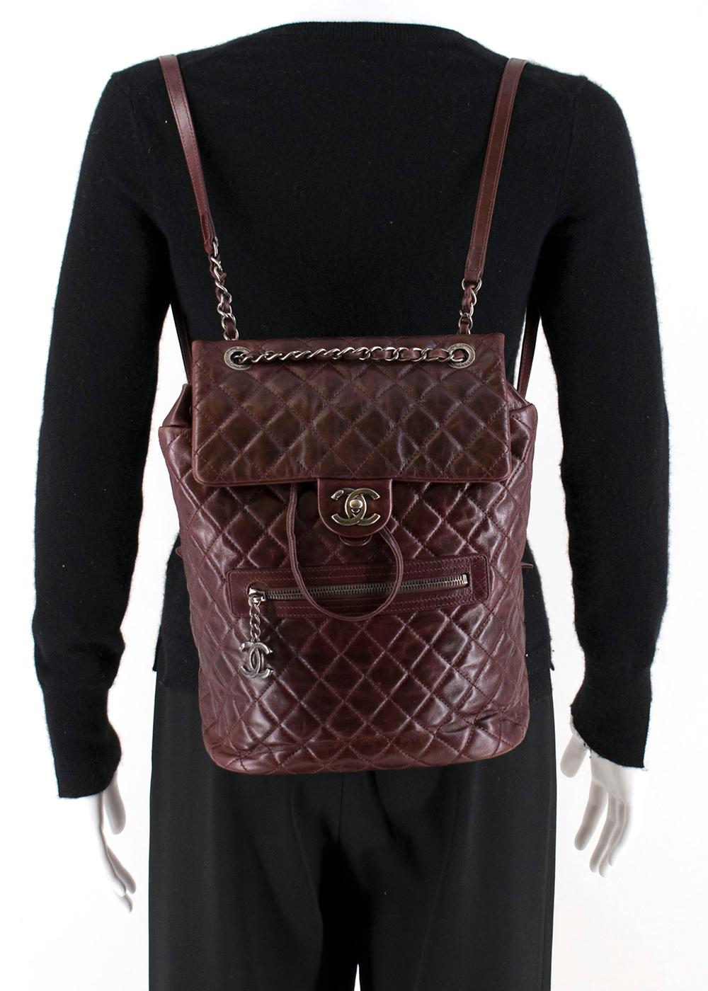 Chanel Glazed Calfskin Quilted Salzburg Backpack Burgundy

-Ruthenium Hardware with CC lock & Drawstring closure 
-Aged quilted calfskin leather 
-Front zip pocket
-Adjustable straps 
-Nylon lining and inside zip pocket

Approx -

Length -