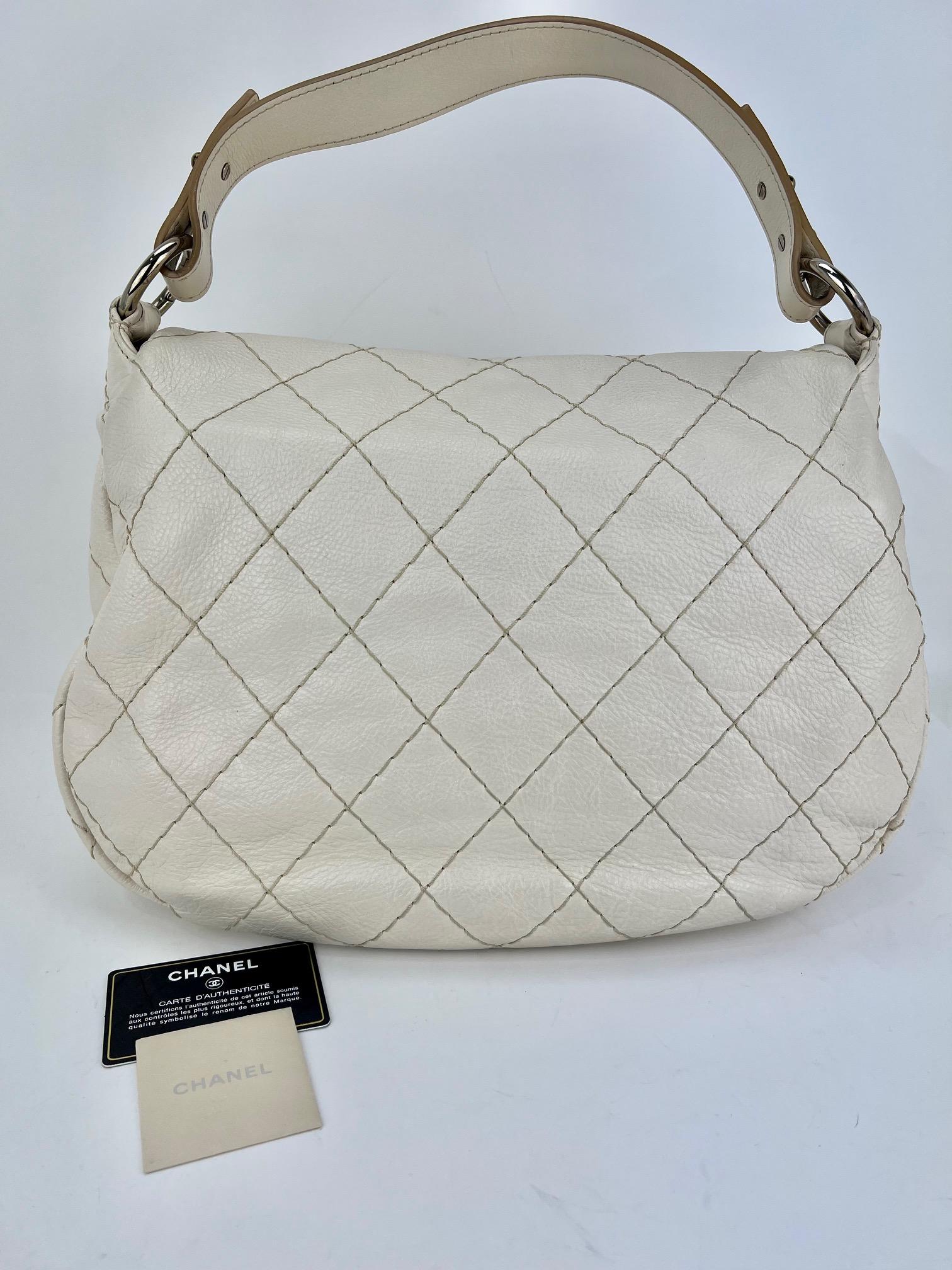 Pre-Owned  100% Authentic
CHANEL Glazed Calfskin White Stitched XL on the road
Flap Added Insert to help Organize and Keep Shape
RATING: A/B   very Good, well maintained,
shows minor signs of wear
MATERIAL: lambskin quilted caviar leather
HANDLE: