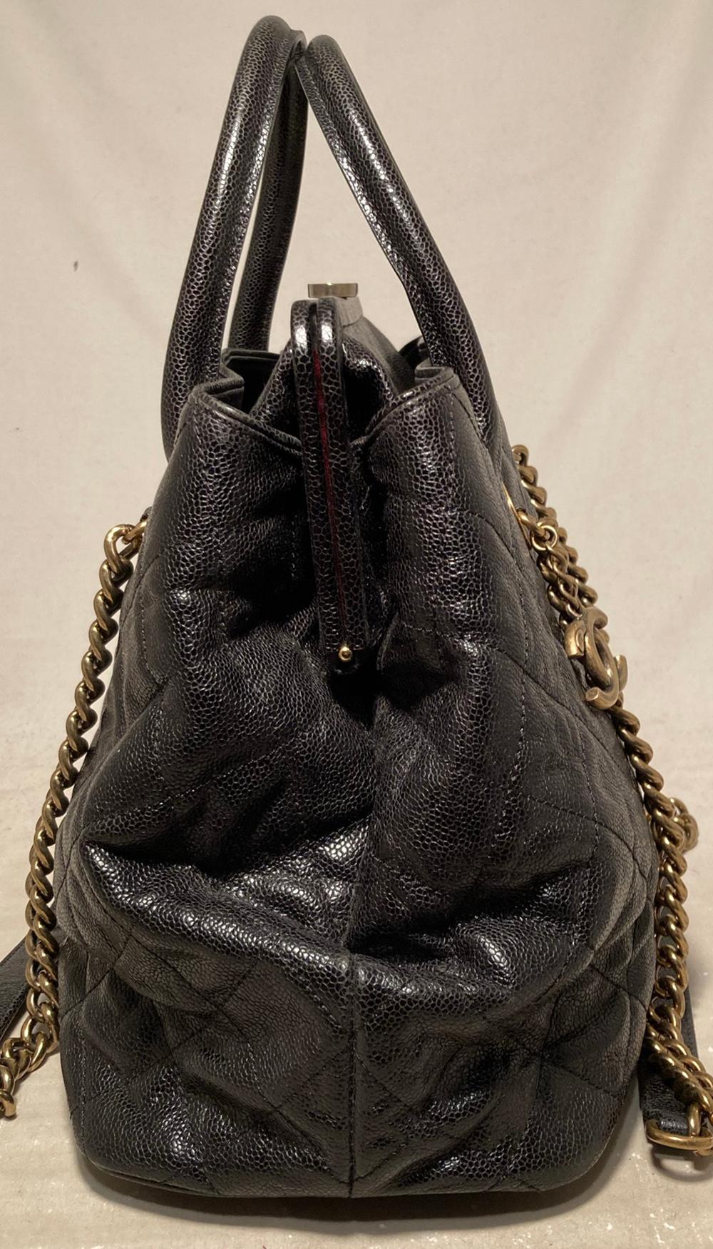 Chanel Glazed Caviar Large Frame Tote Bag in very good condition. Quilted glazed caviar leather exterior trimmed with antiqued brass hardware, double top handles and double shoulder straps. Two exterior side pockets lined in dark red canvas. Top