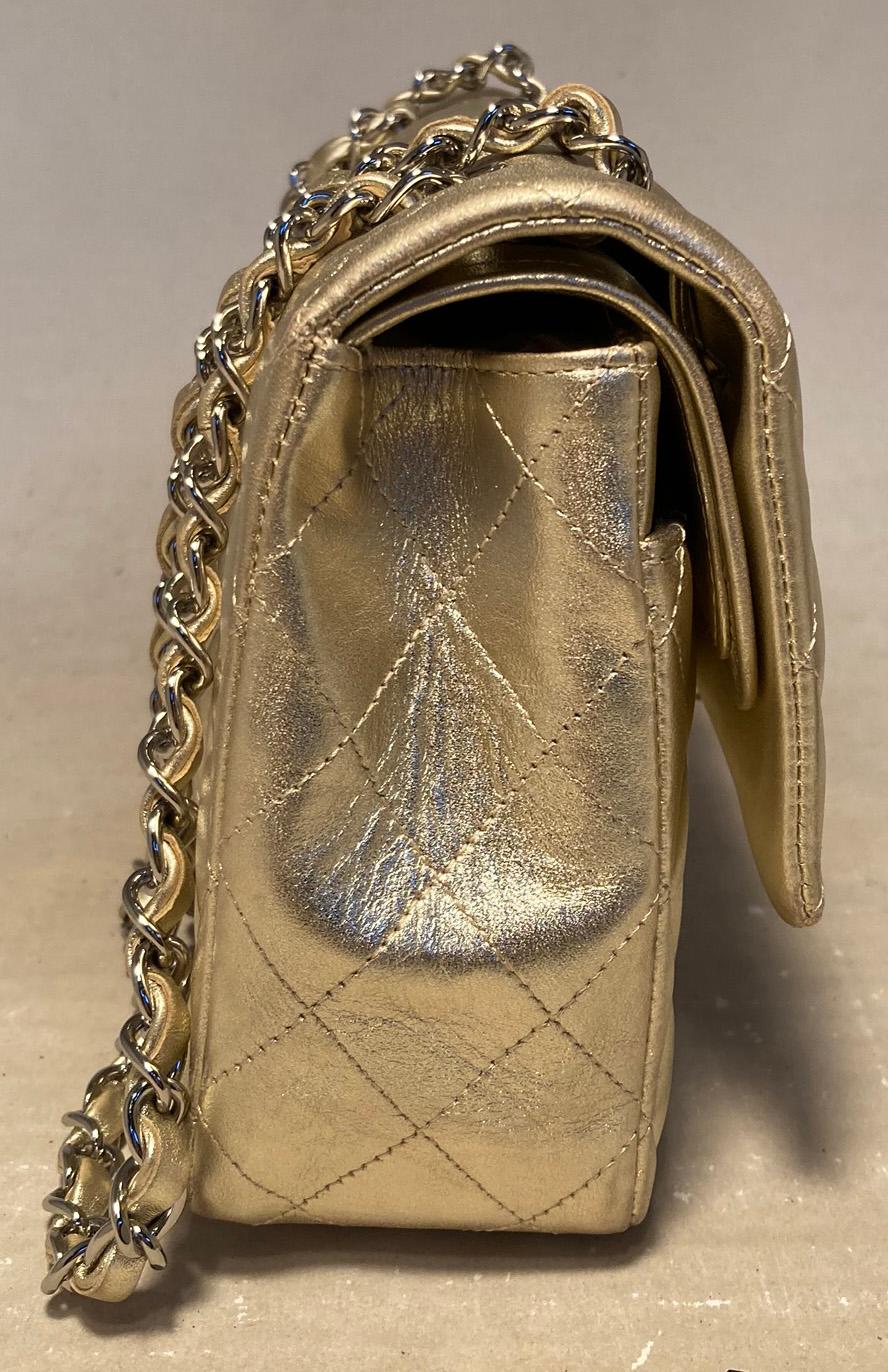 Chanel Gold 10inch 2.55 Double Flap Classic Shoulder Bag in excellent condition. Gold quilted leather exterior trimmed with gold hardware and signature woven chain and leather shoulder strap. Front CC logo twist closure opens via double flap to a