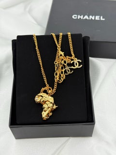 CHANEL Gold Africa Map Crystal CC Pendant Necklace