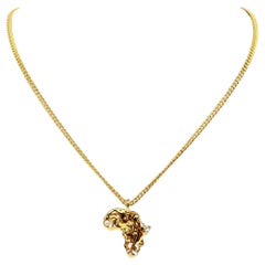 CHANEL Gold Africa Map Crystal CC Pendant Necklace