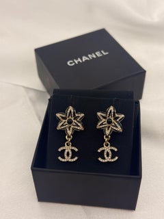 CHANEL Gold and Black Camellia Crystal Dangle Earrings with CC Charm