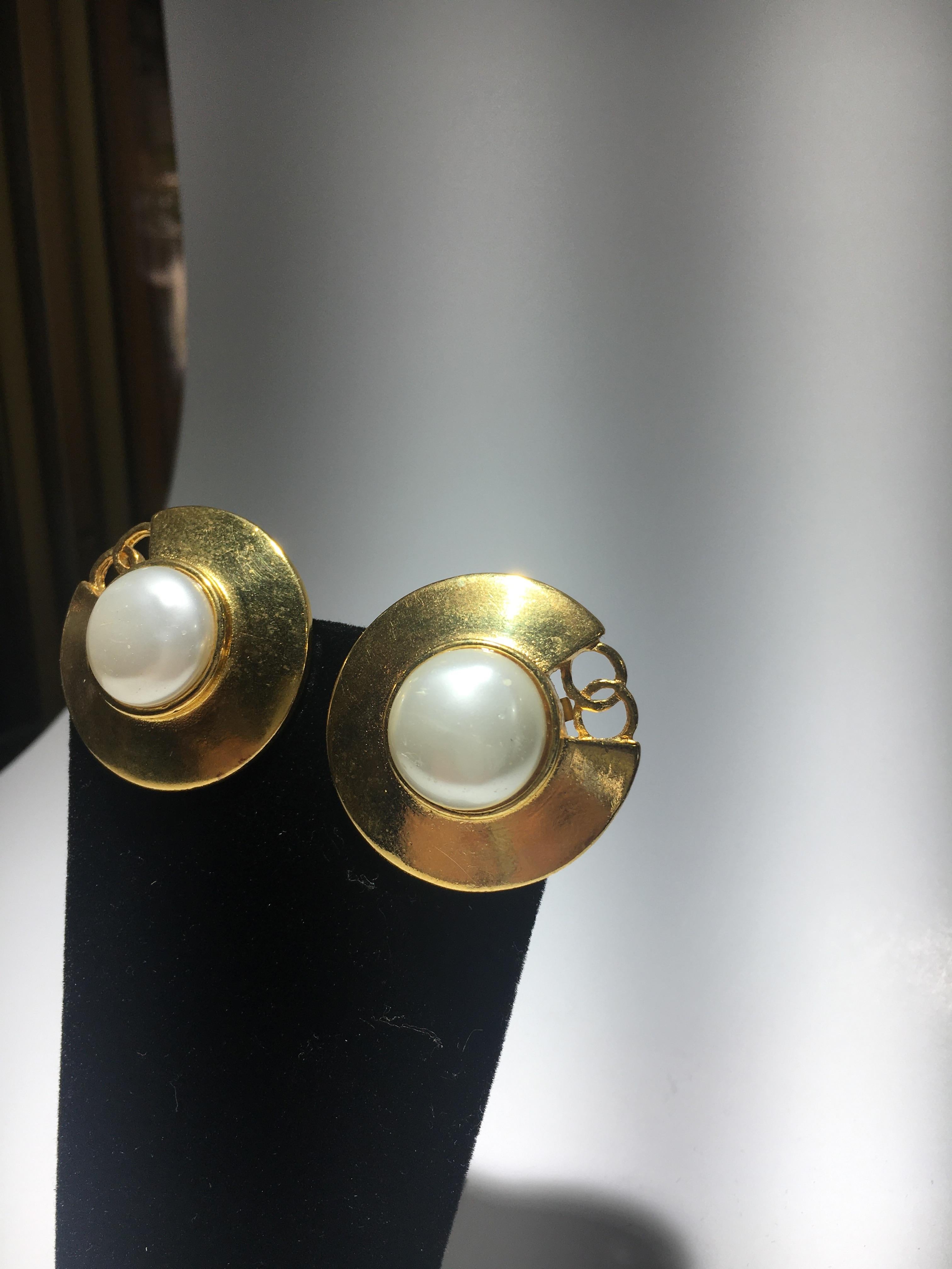 Chanel Gold And Mobe Pearl Earings With Signature Interlocking CC.  Great Scale.  Feel free to call as we have a nice selection of Chanel.