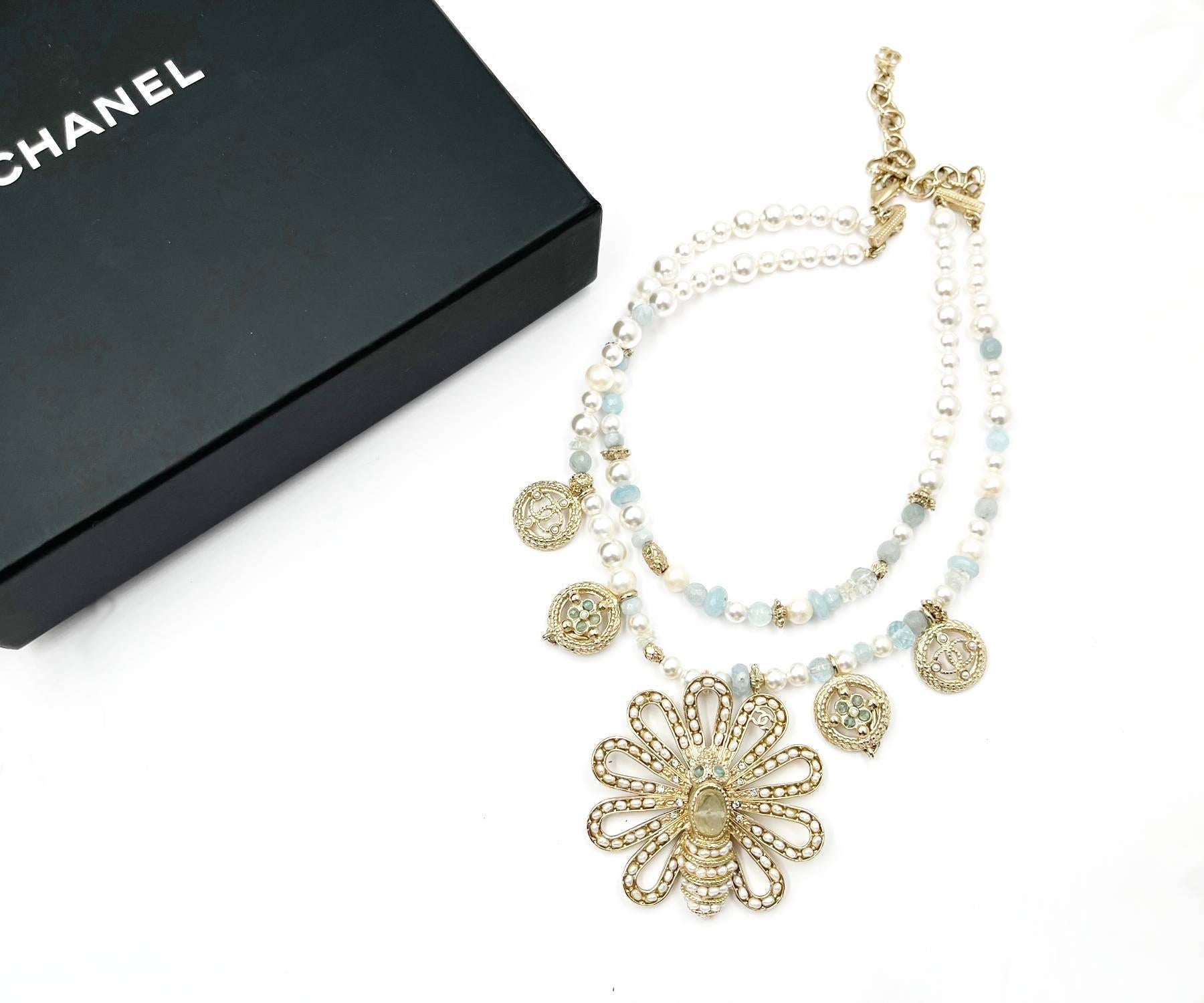 Chanel Gold Bee Seed Pearl Pendants 2 Strand Aquamarine Pearl Necklace

*Marked 18
*Made in France
*Comes with original box and pouch

-Approximately 19″ long
-The largest pendant is approxaimtely 2.3″ x 2.3″.
-Very classic and pretty
-In a pristine