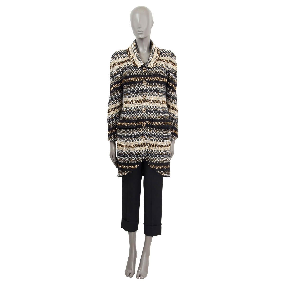 100% authentic Chanel lurex striped single breasted coat in black, beige, gold and off-white polyamide (46%), polyester (31%), wool (21%) and polyethylene (2%). Features two flap pockets on the front, long raglan sleeves (sleeve measurements taken