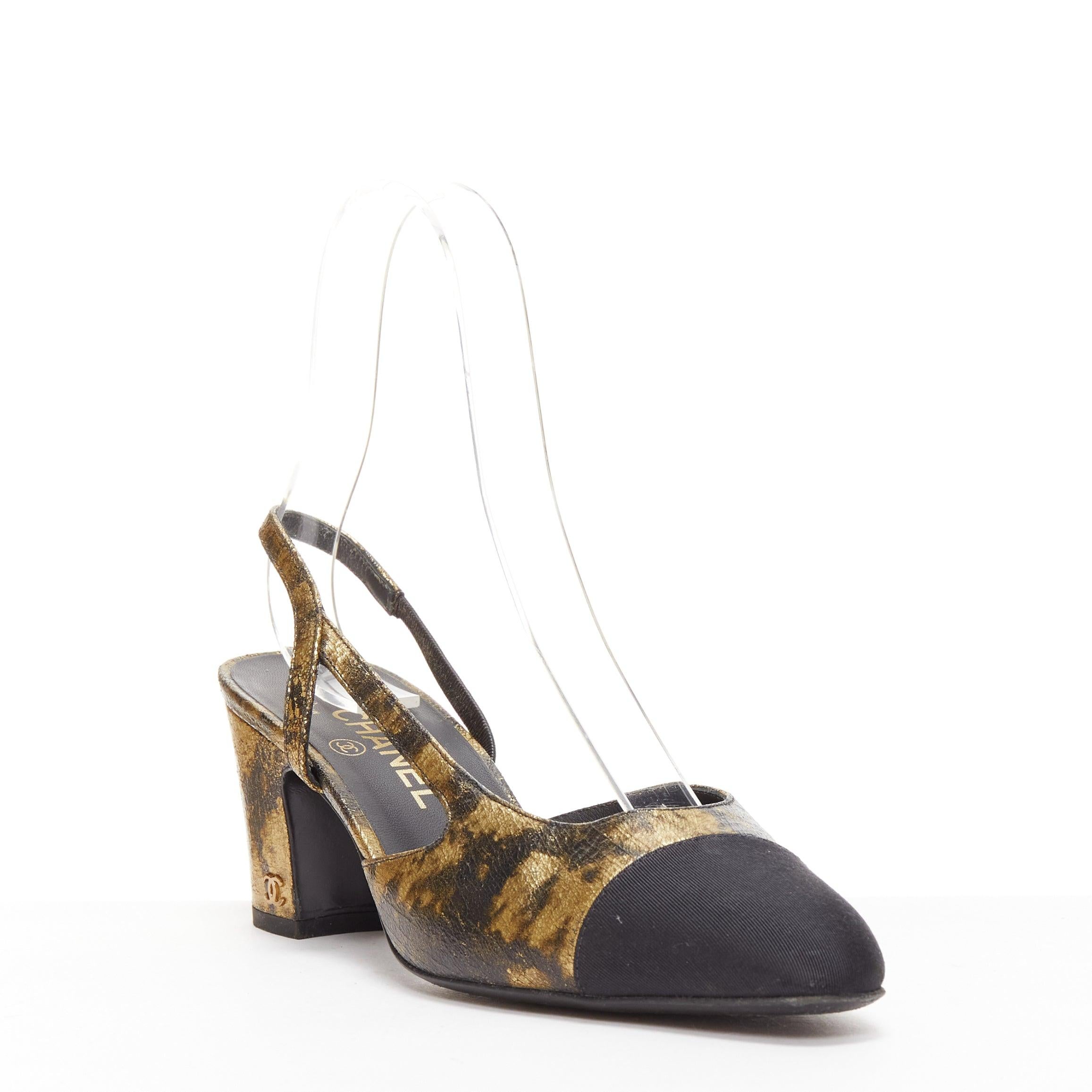 CHANEL gold black calfskinleather CC toe cap sling kitten pumps EU38
Reference: TGAS/D01132
Brand: Chanel
Designer: Karl Lagerfeld
Model: 2018-19
Material: Leather, Fabric
Color: Gold, Black
Pattern: Solid
Closure: Slip On
Lining: Black