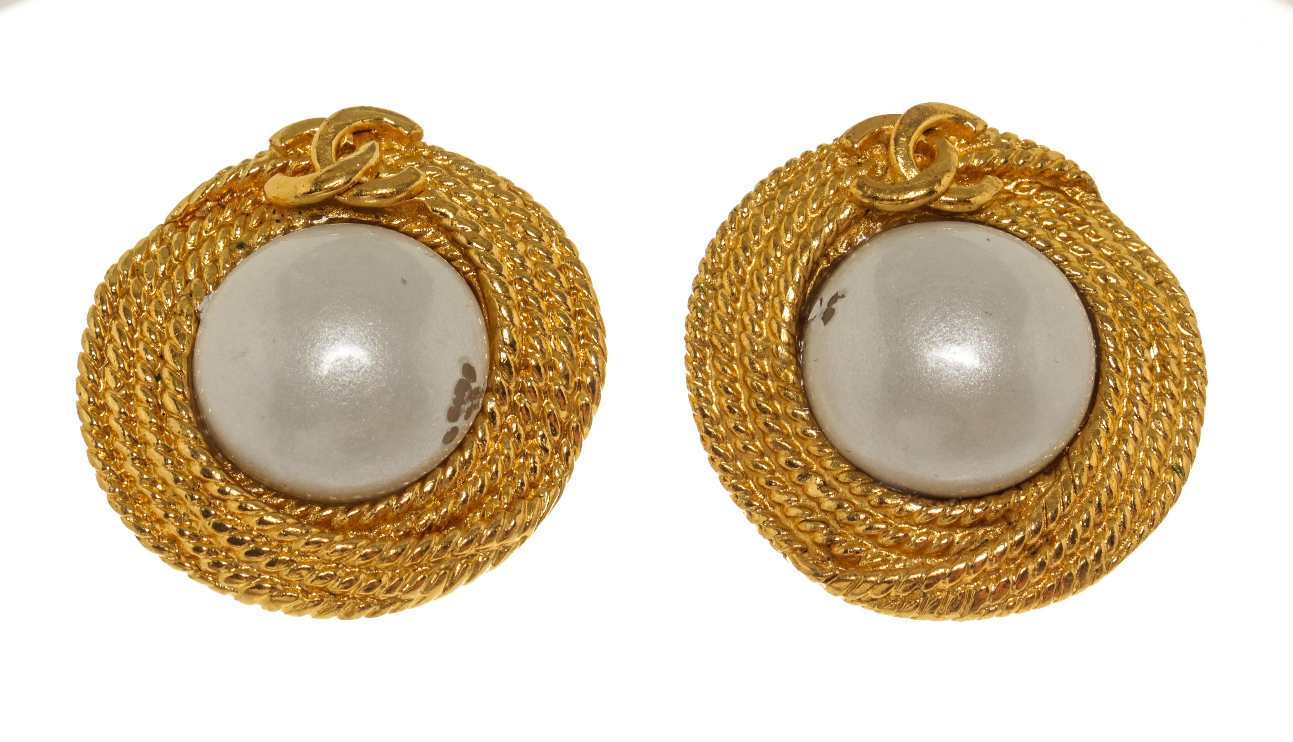Chanel Gold Braided Pearl Logo Earrings with faux pearls, and gold tone metal hardware. 

770007MSC