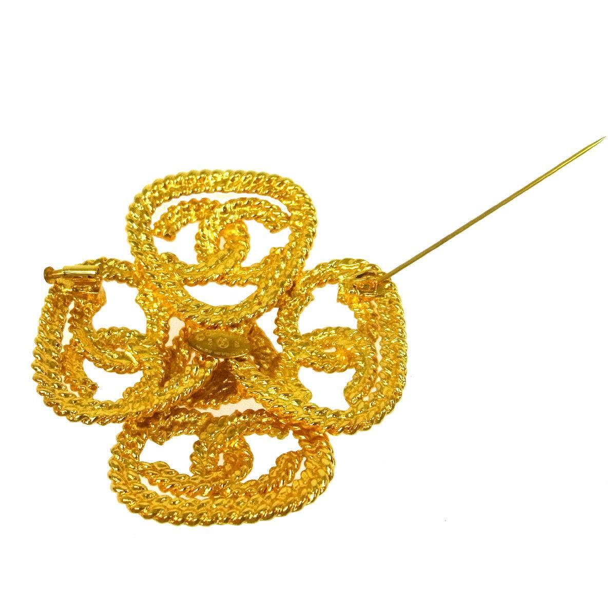 Chanel Gold Braided Textured Cross Charm Evening Lapel Pin Brooch In Good Condition In Chicago, IL