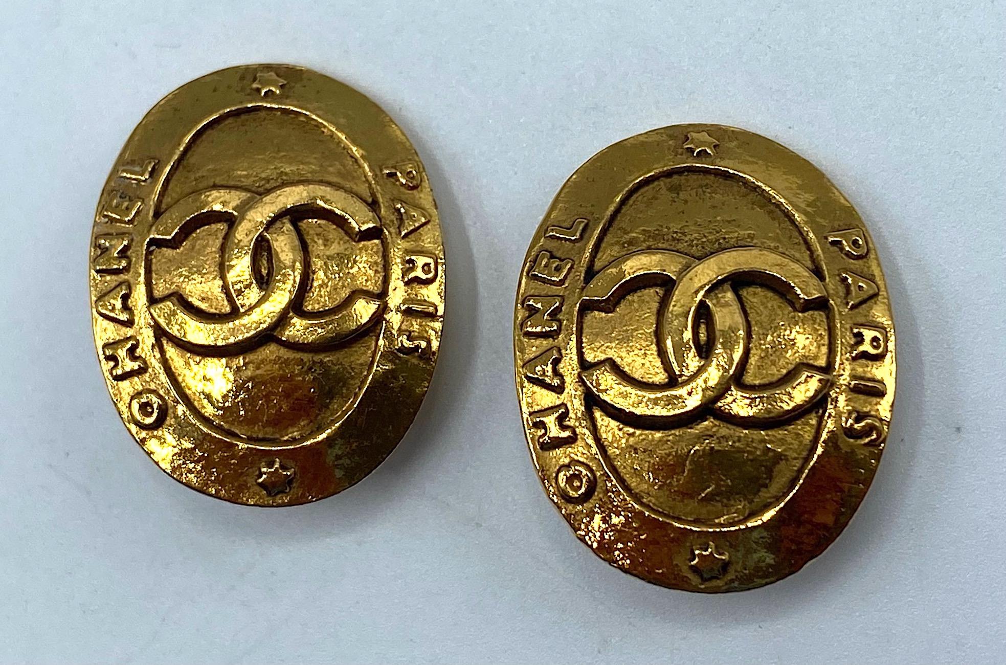 A beautiful pair of Chanel button style earrings from 1991. Produced under the direction of jewelry designer Victoire De Castellane who was hired by Karl Lagerfeld for Chanel in 1986. Each earring is a rich 18K gold plate, measures .88 of an inch