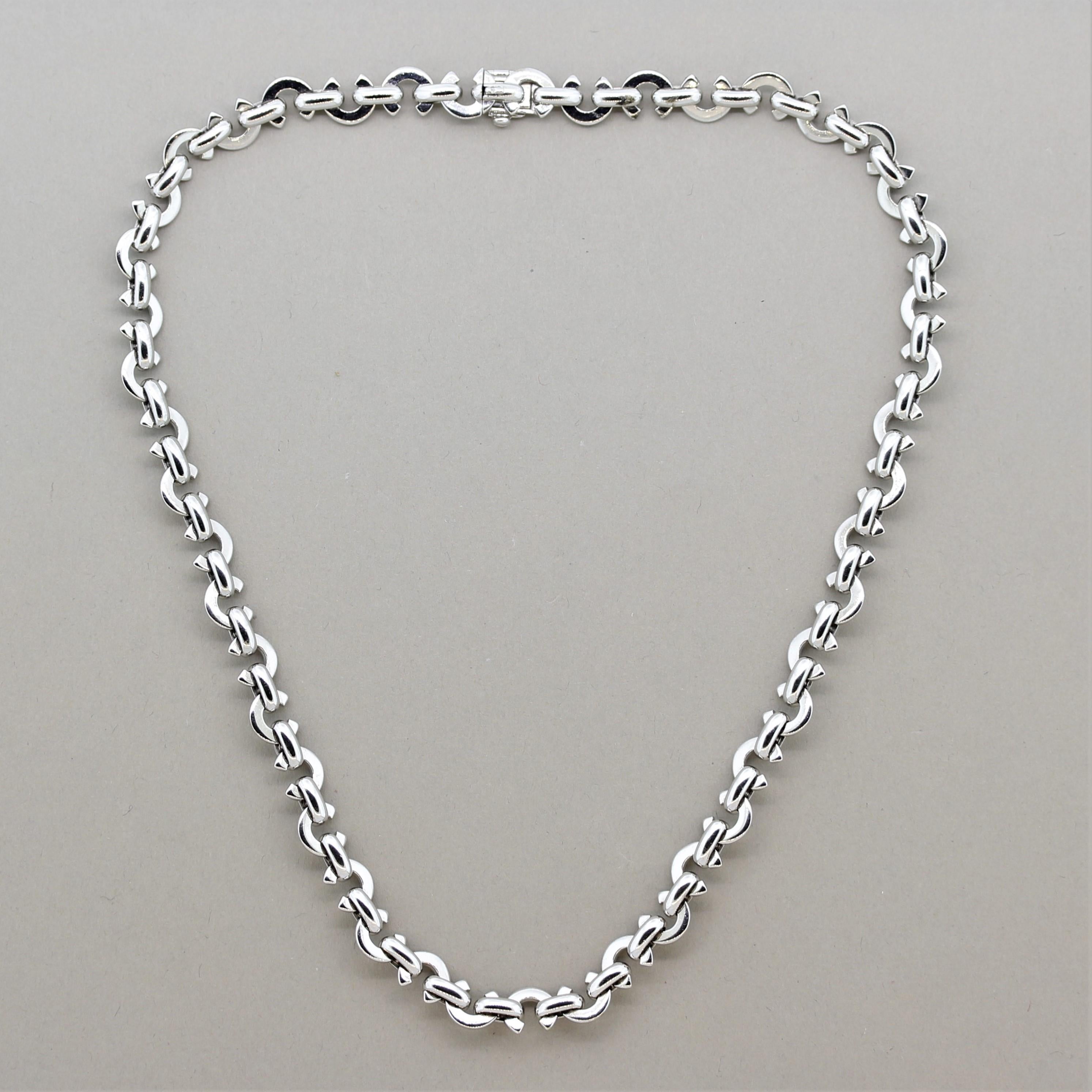 A classic “C” necklace by French designer Chanel! It is made in 18k white gold and features their logo around the entirety of the necklace. Measuring 16 inches in length, this is the perfect necklace for everyday wear.

Length: 16 inches