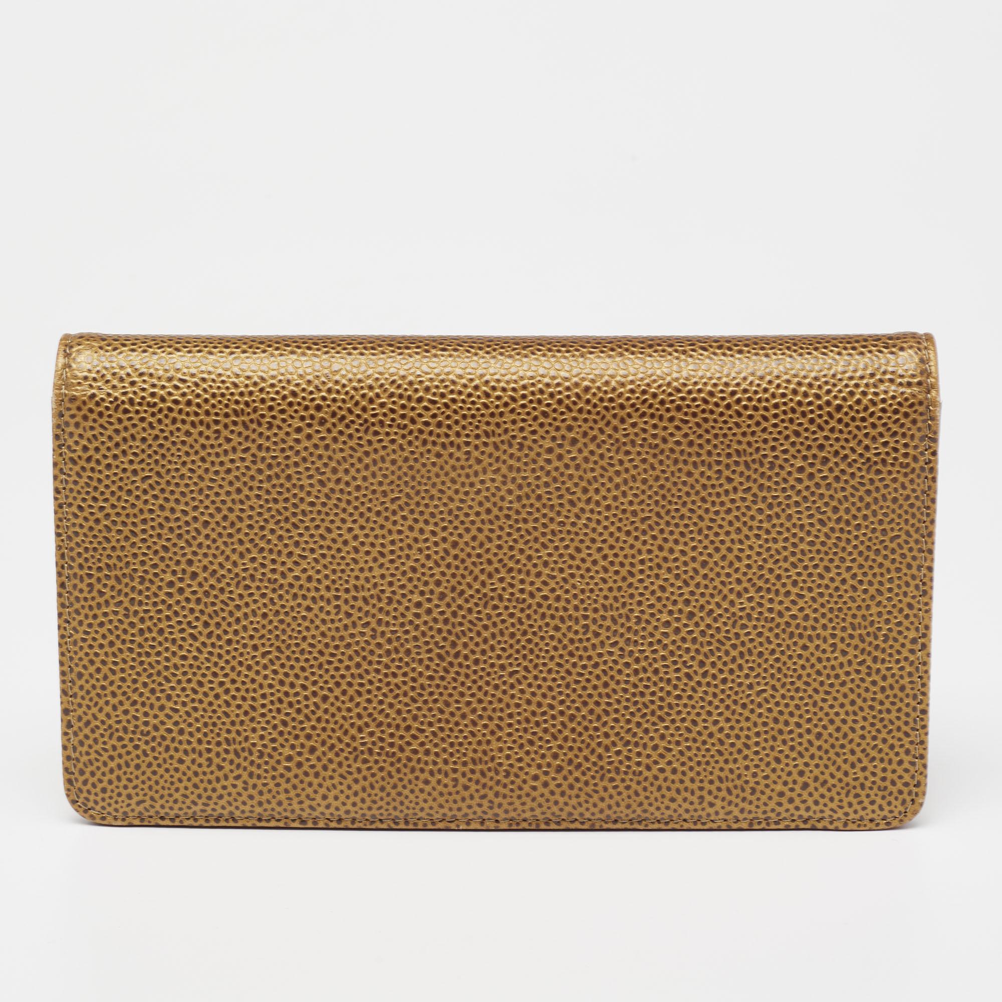 A classic wallet like this one from Chanel will make a great companion for every day. It features a gold Caviar leather body and features a bi-fold silhouette. This wallet comes equipped with several card slots and pockets to secure your cards and