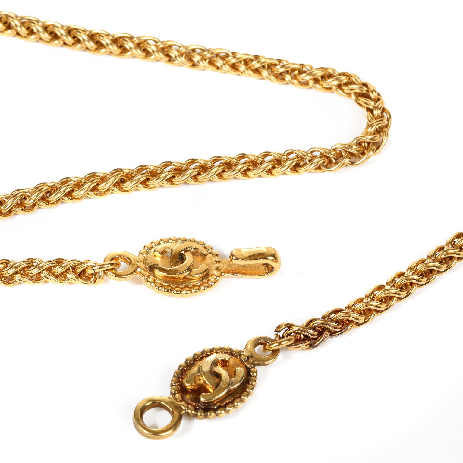 This authentic Chanel Gold CC Clover Medallion Necklace is in excellent condition from the mid 1990’s.   A large gold tone clover shaped medallion is adorned with interlocking CC logos.  Suspended from a substantial long gold wheat style chain. 