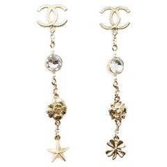 Chanel Gold CC Kristall Löweide Blume Stern Kleeblatt Lange durchbrochene Ohrringe