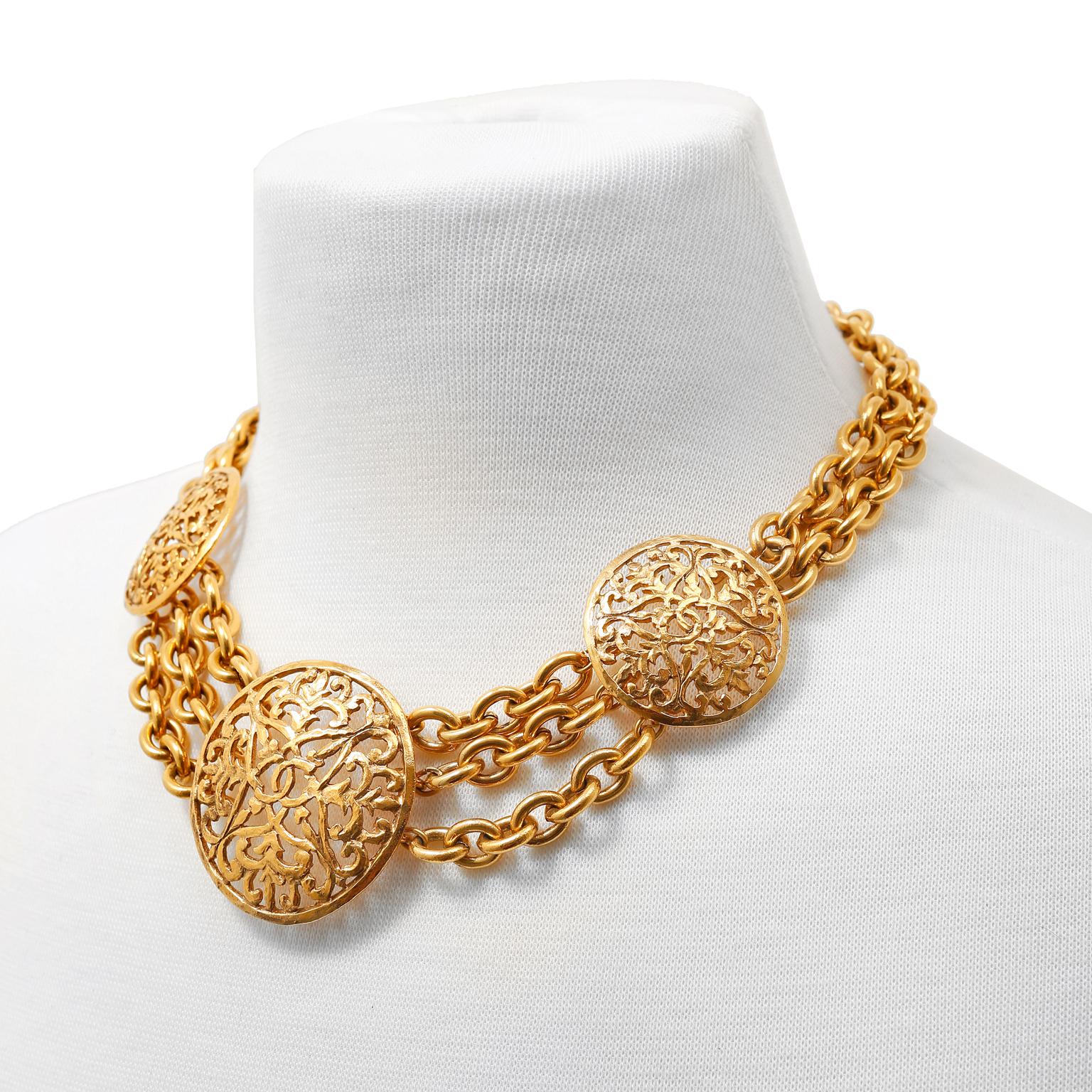 This authentic Chanel Gold CC Disc Multi Strand Choker is in excellent condition.  Gold plated ornate open work discs are situated on 24 karat gold plated linked chains.   Adjustable length approximately 19 inches.
PBF 11357

