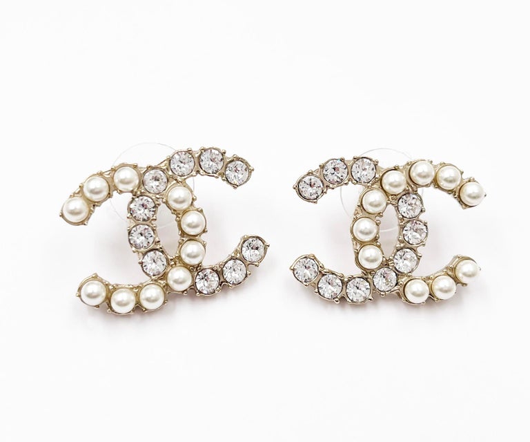 Chanel Gold CC Half Half Pearl Crystal Large Piercing Earrings For Sale at  1stDibs | chanel pearl earrings, chanel piercing, chanel ribbon earrings