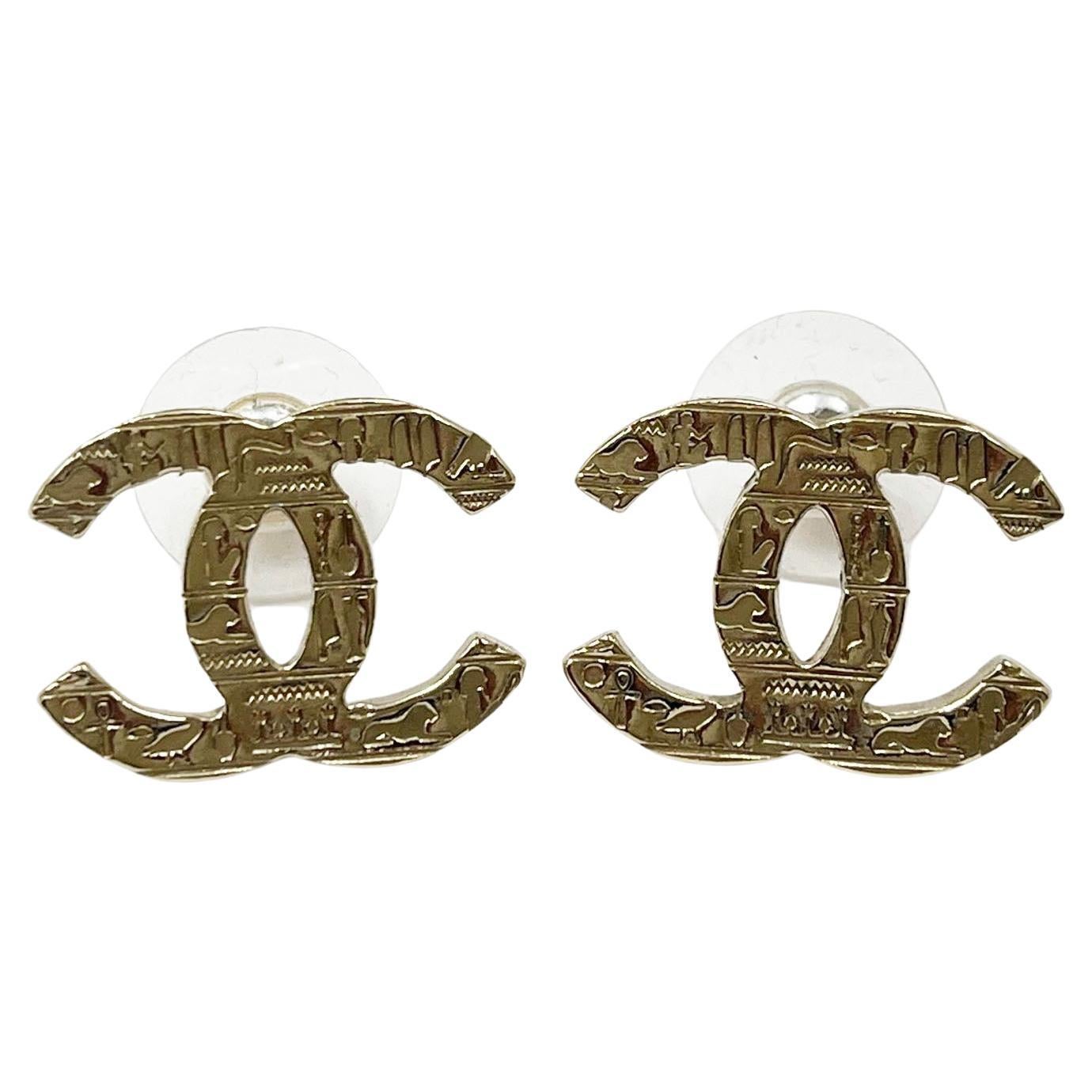 Chanel Classic Gold CC Hieroglyphs Stud Piercing Earrings  For Sale