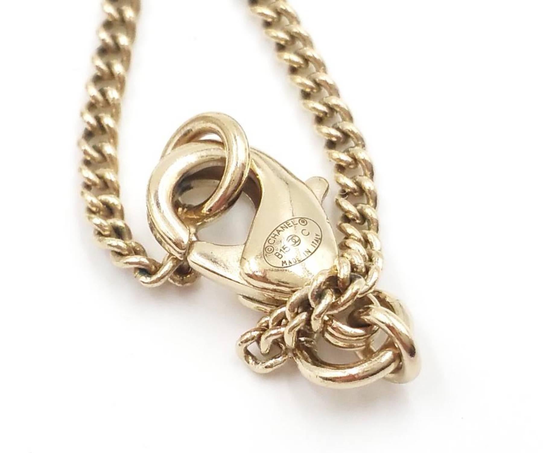 chanel gold pendant