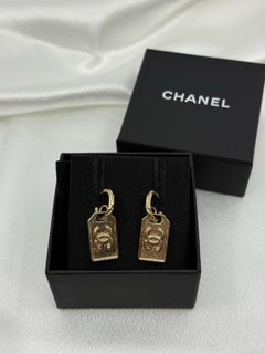 CHANEL Gold CC Plate Dangle Earrings