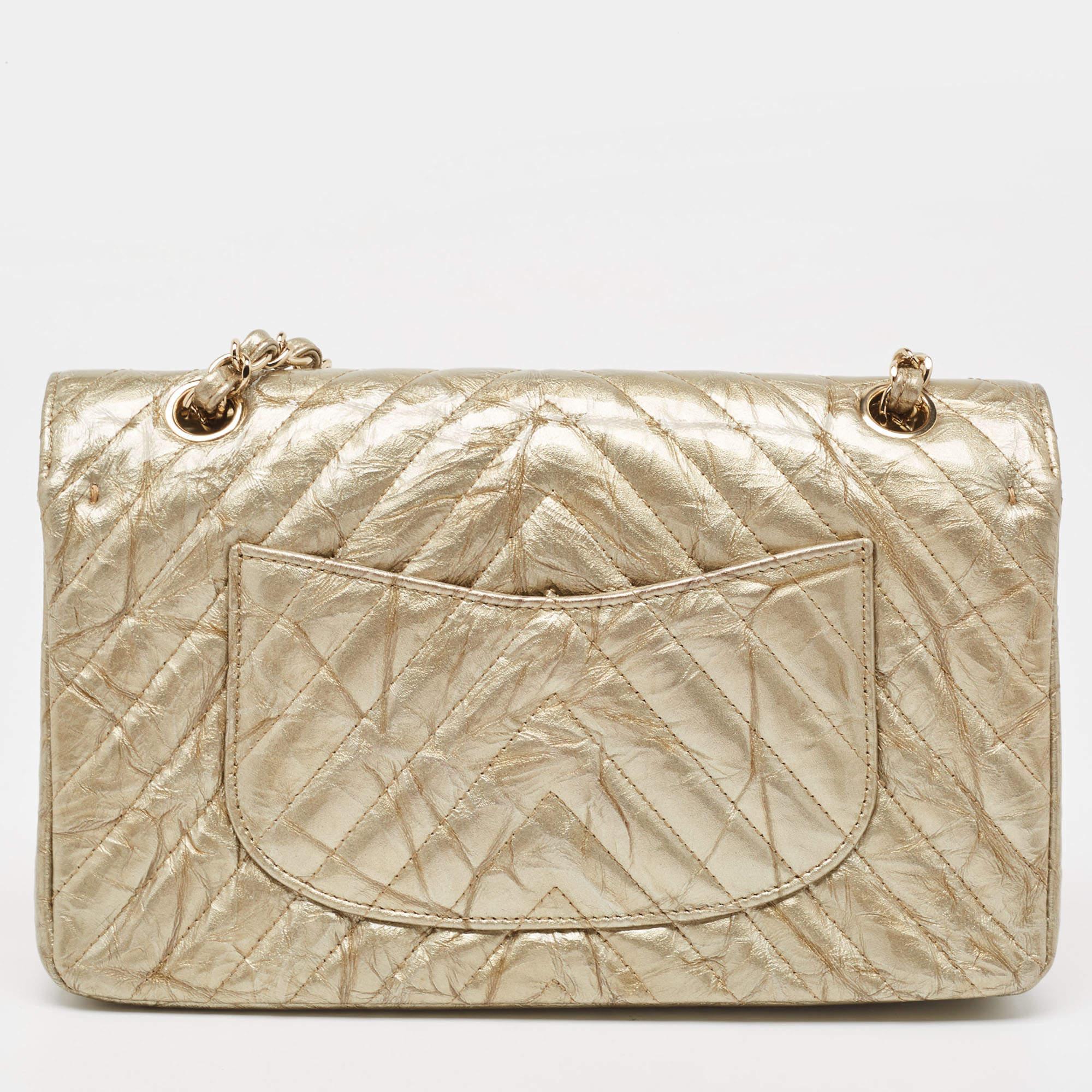 We are in utter awe of this flap bag from Chanel as it is appealing in a surreal way. Exquisitely crafted from caviar patent leather in a chevron design, it bears their signature label on the leather interior and the iconic CC turn-lock on the flap.