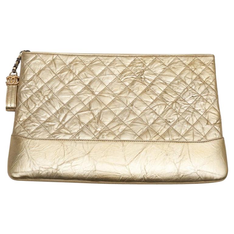 CHANEL Gold Clutch In Aged Leather