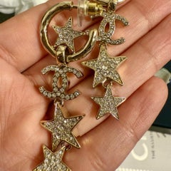 Boucles d'oreilles pendantes CHANEL « Gold Crystal CC Star »