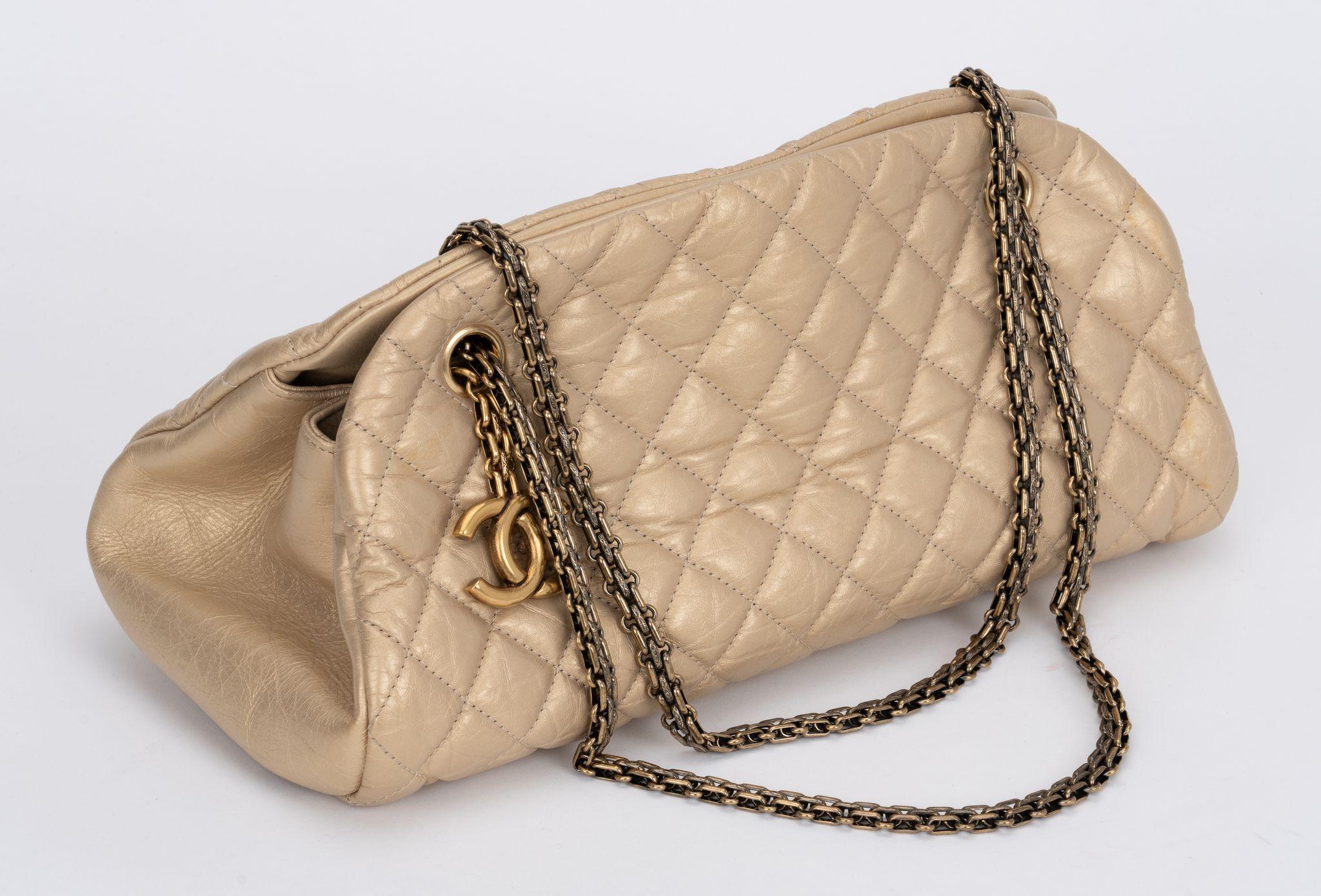 Chanel gold distressed mademoiselle bag with bronze hardware. excellent condition. Shoulder drop 8