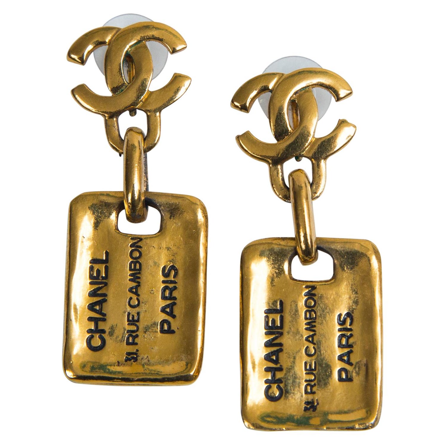 Chanel Gold Dog Tag Earrings at 1stDibs | chanel dog tag earrings, chanel  tag earrings, chanel gold tag earrings