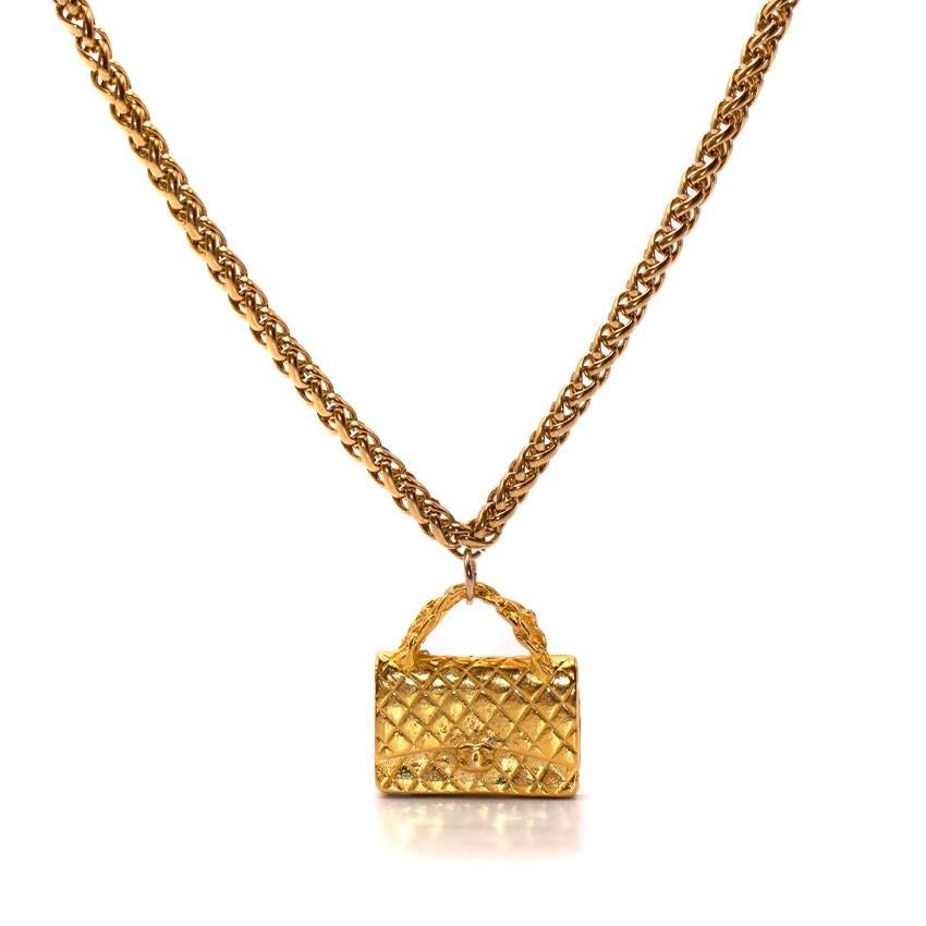 Chanel Gold Flap Bag Necklace

-Vintage gold plated chain necklace with bag pendent
-Lobster clasp closure
-Flap bag pendent shows quilted, chain and 'CC' clasp details

Please note, these items are pre-owned and may show signs of being stored even