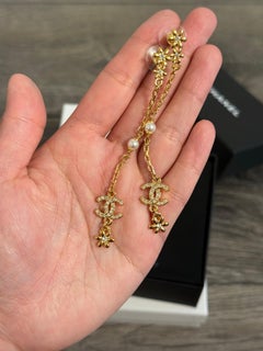 CHANEL Gold Flower Crystal CC Long Chain Dangle Earrings