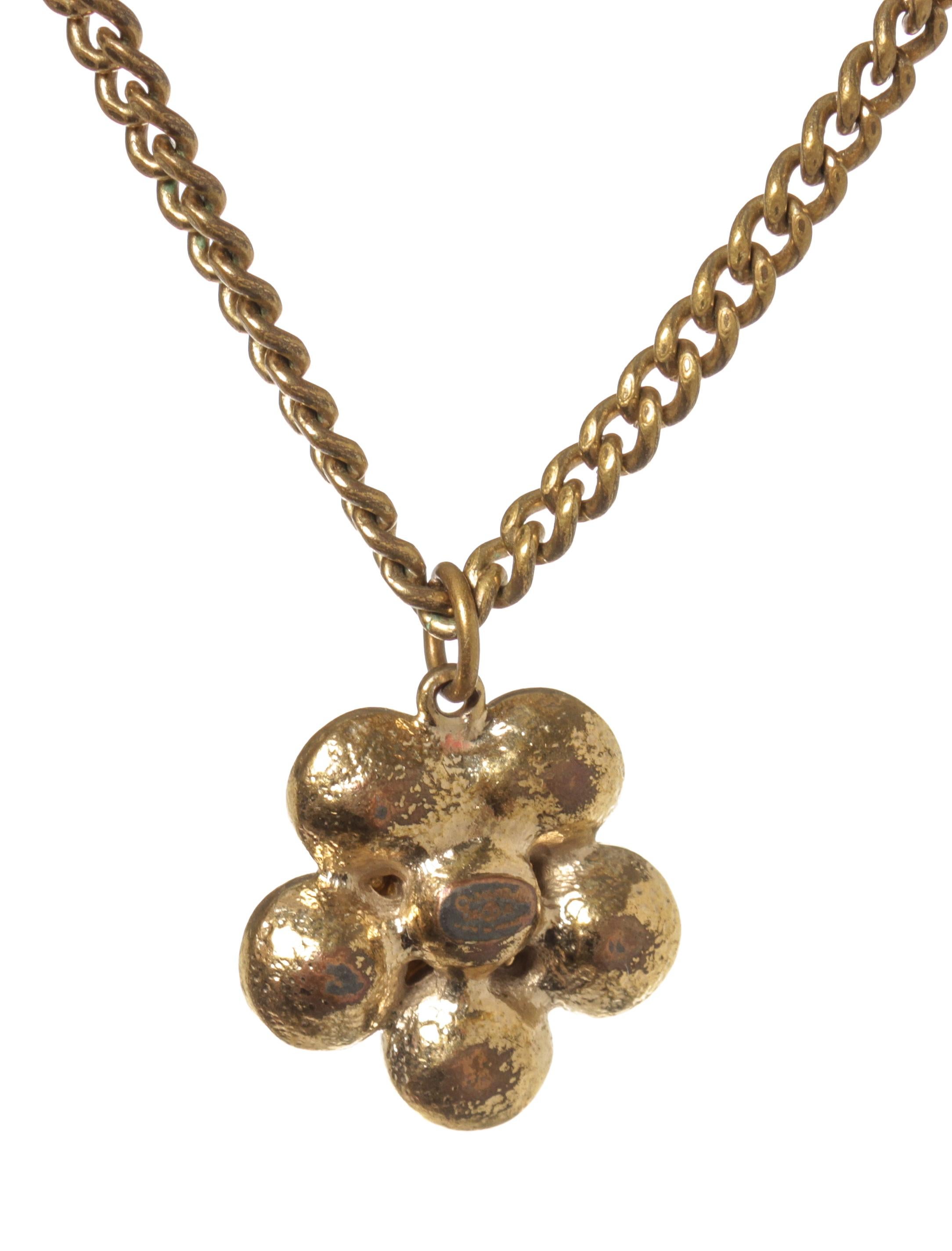 Chanel Gold Flower Necklace with gold tone hardware, flower pendant with CC logo with rhinestones. 

770060MSC
