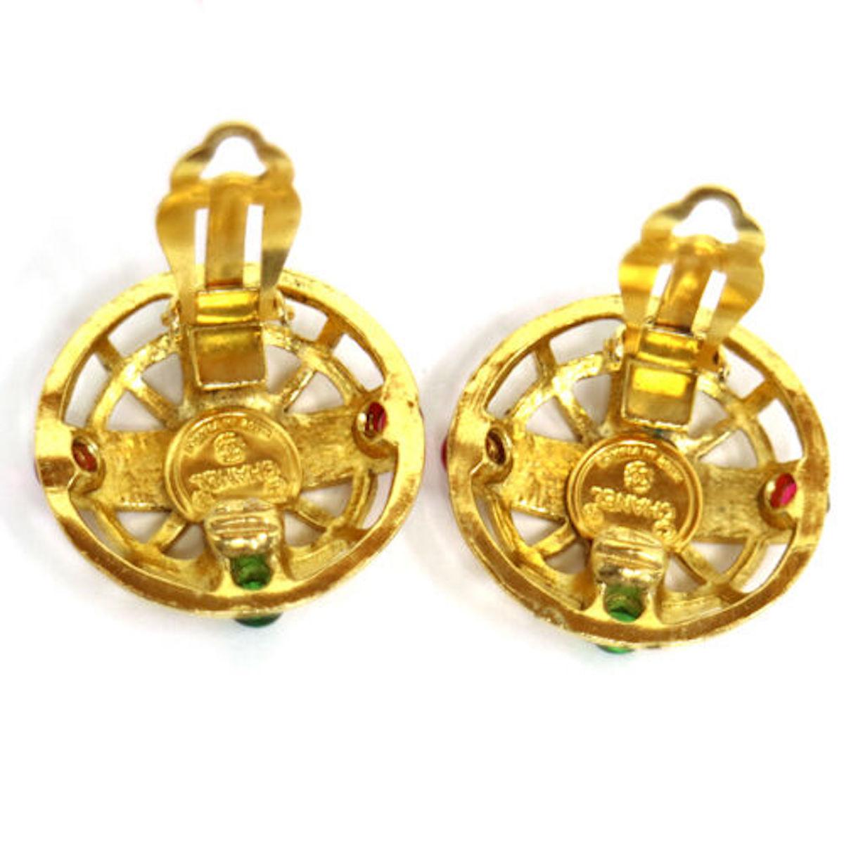 Chanel Gold Green Red Gripoix 'CHANEL' Button Evening Earrings

Metal 
Gripoix
Gold tone
Clip on closure 
Made in France
Diameter 1