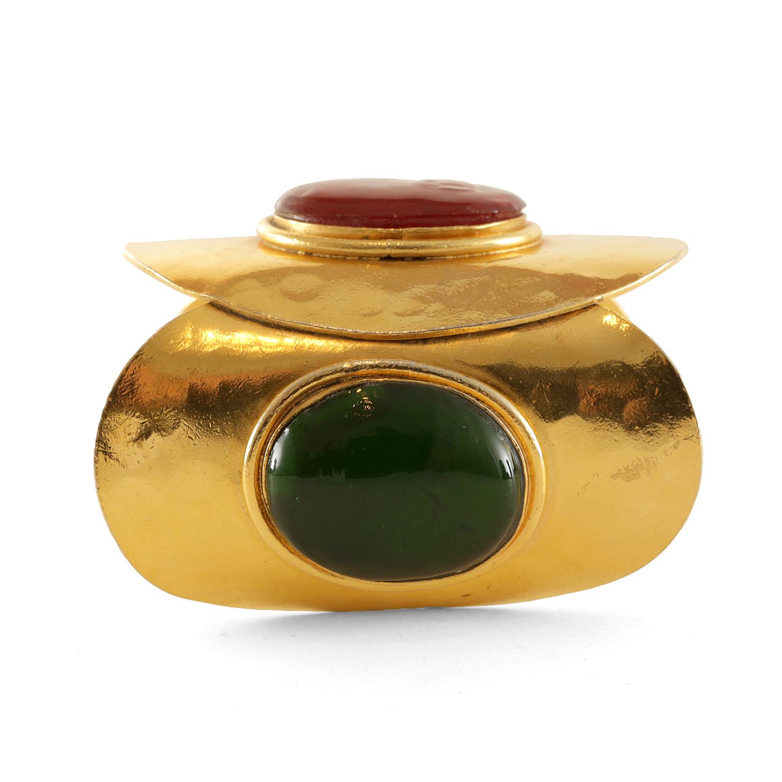 Chanel Gold Gripoix Cuff - excellent condition.  
Large gold tone cuff combines three oval plates.  Adorned with red and green Gripoix poured glass stones.  

