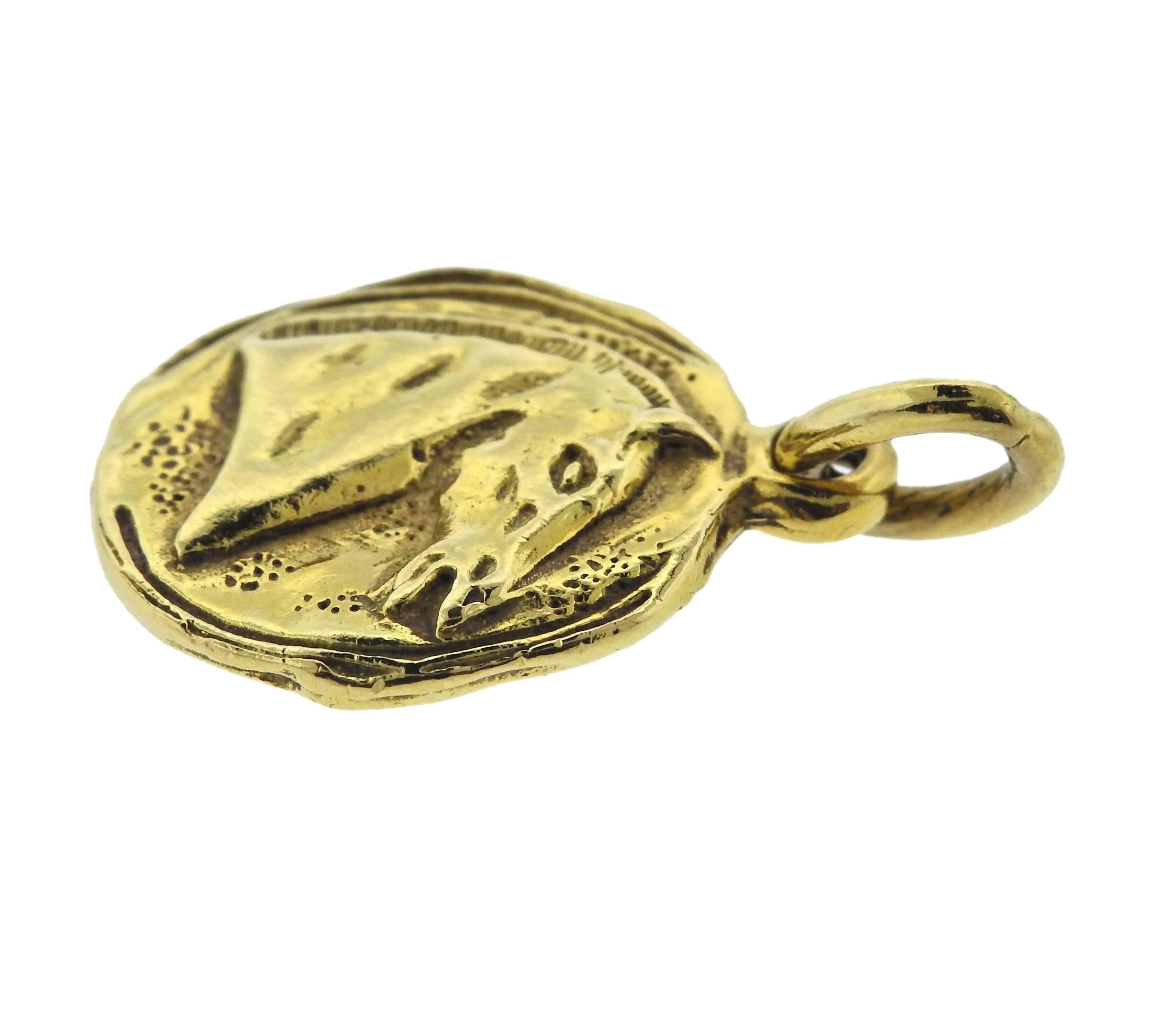  18k yellow gold medallion pendant, crafted by Chanel, depicting horse head. Pendant is 20mm x 33mm with bale, weighs 9.5 grams. Marked: 0.750, Chanel.