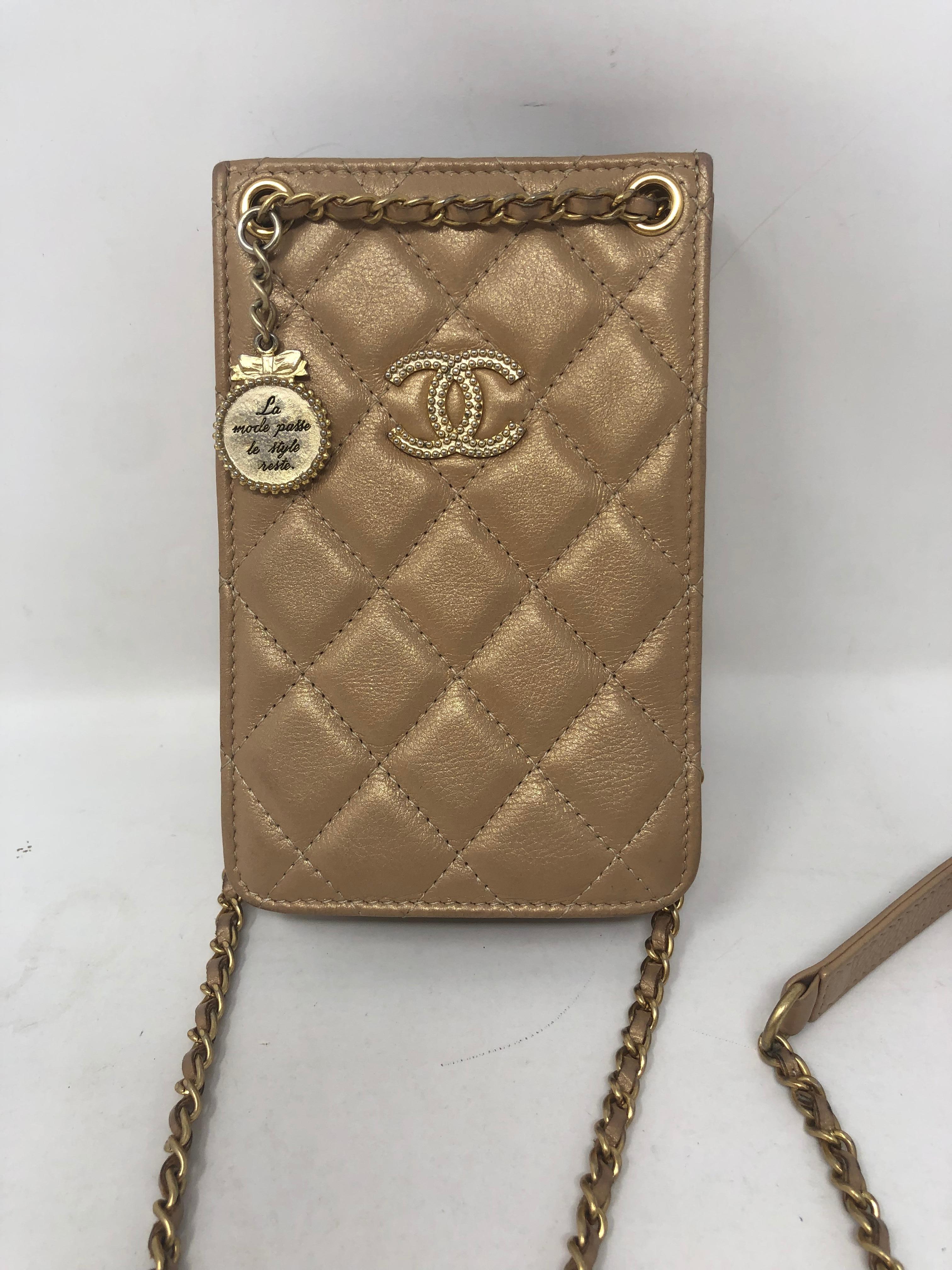 Chanel Gold Phone Holder Crossbody Bag. Gold leather with gold hardware. Can fit Iphone easily for it's size should be stadium approved. Mint condition. Ready to be worn.Guaranteed authentic. 