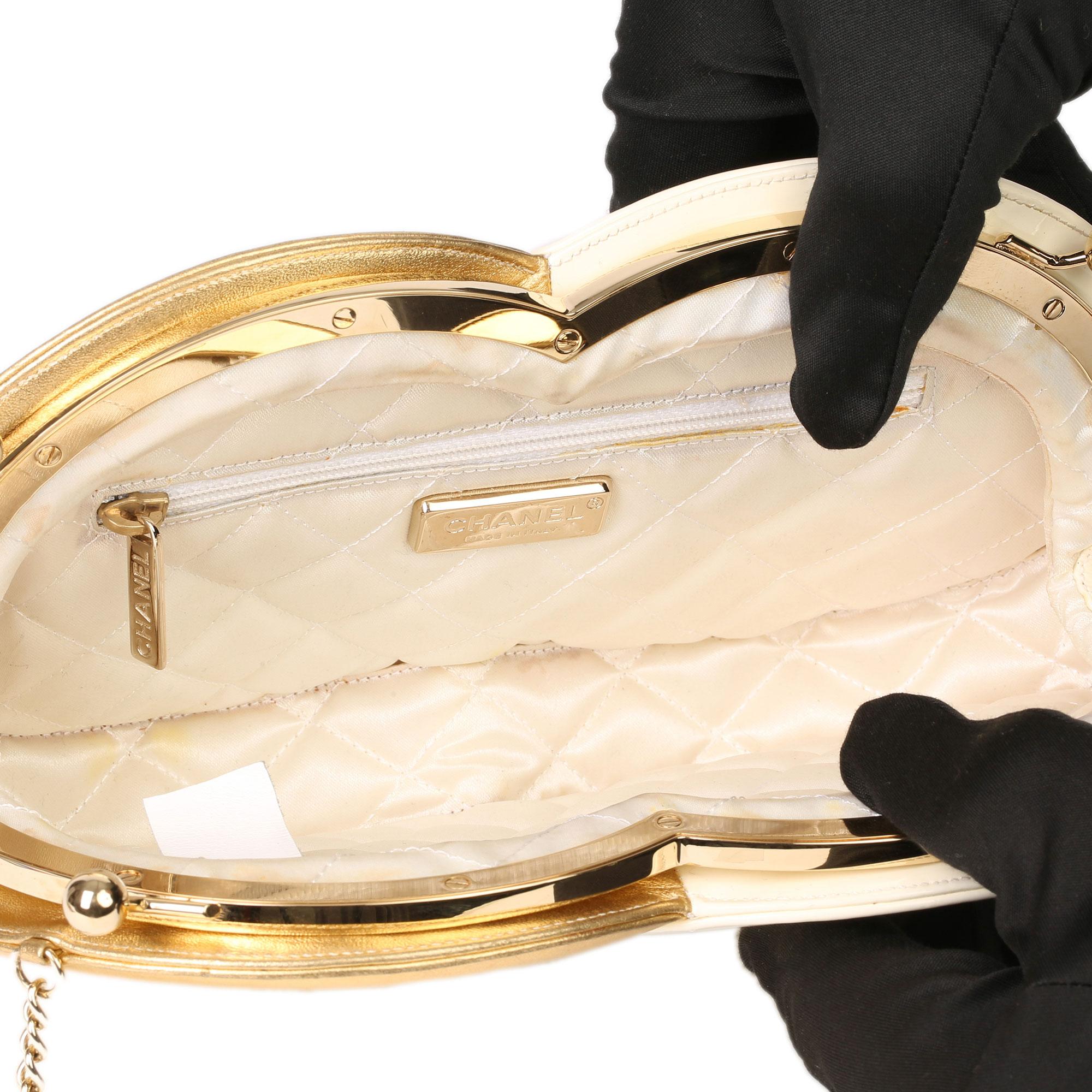CHANEL
Gold Lambskin & Beige Patent Leather Double Circle Clutch

Serial Number: 11321198
Age (Circa): 2007
Accompanied By: Chanel Dust Bag, Authenticity Card
Authenticity Details: Serial Sticker, Authenticity Card (Made in Italy)
Gender: