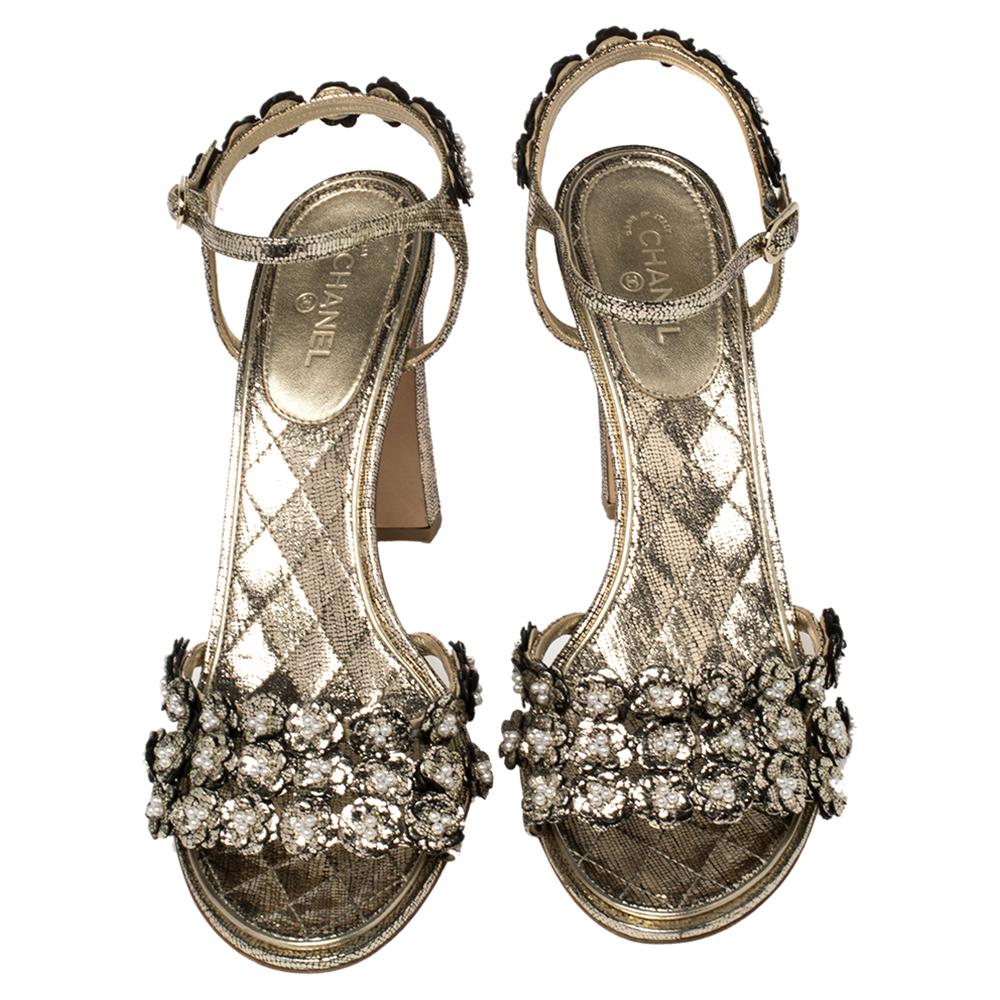 Now here is one pair that truly stands out and deserves all your attention! These gold sandals from Chanel have been crafted from leather and designed in an open toe silhouette with exquisite camellia motif embellished vamp straps and ankle straps.