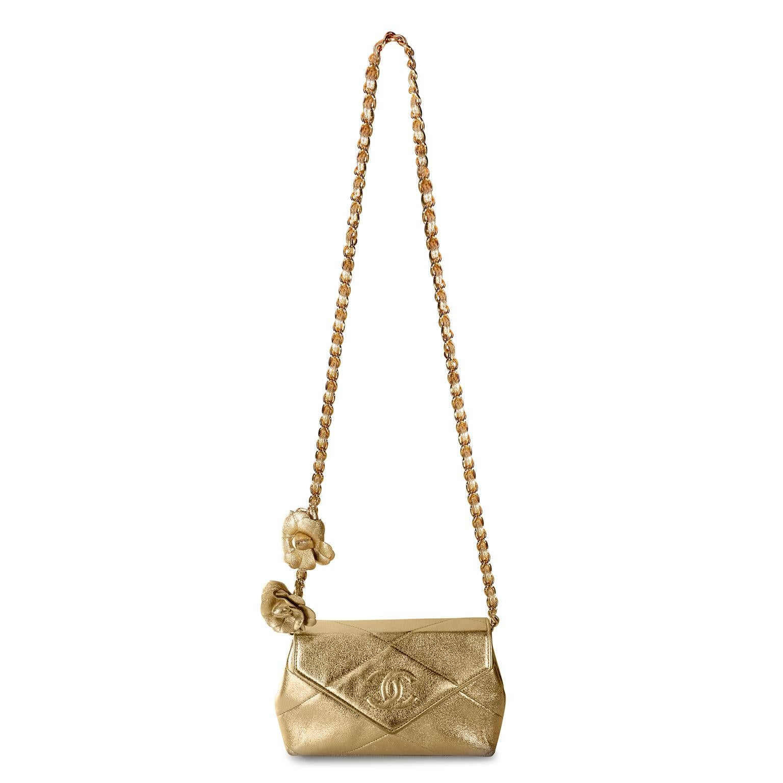 Chanel Gold Vintage Camellia Flower Evening Bag- excellent condition
 A rare style from the 1980’s in exquisite condition, it is a must have for collectors.
Gold metallic leather small  envelope flap bag.  Tonally stitched interlocking CC on front