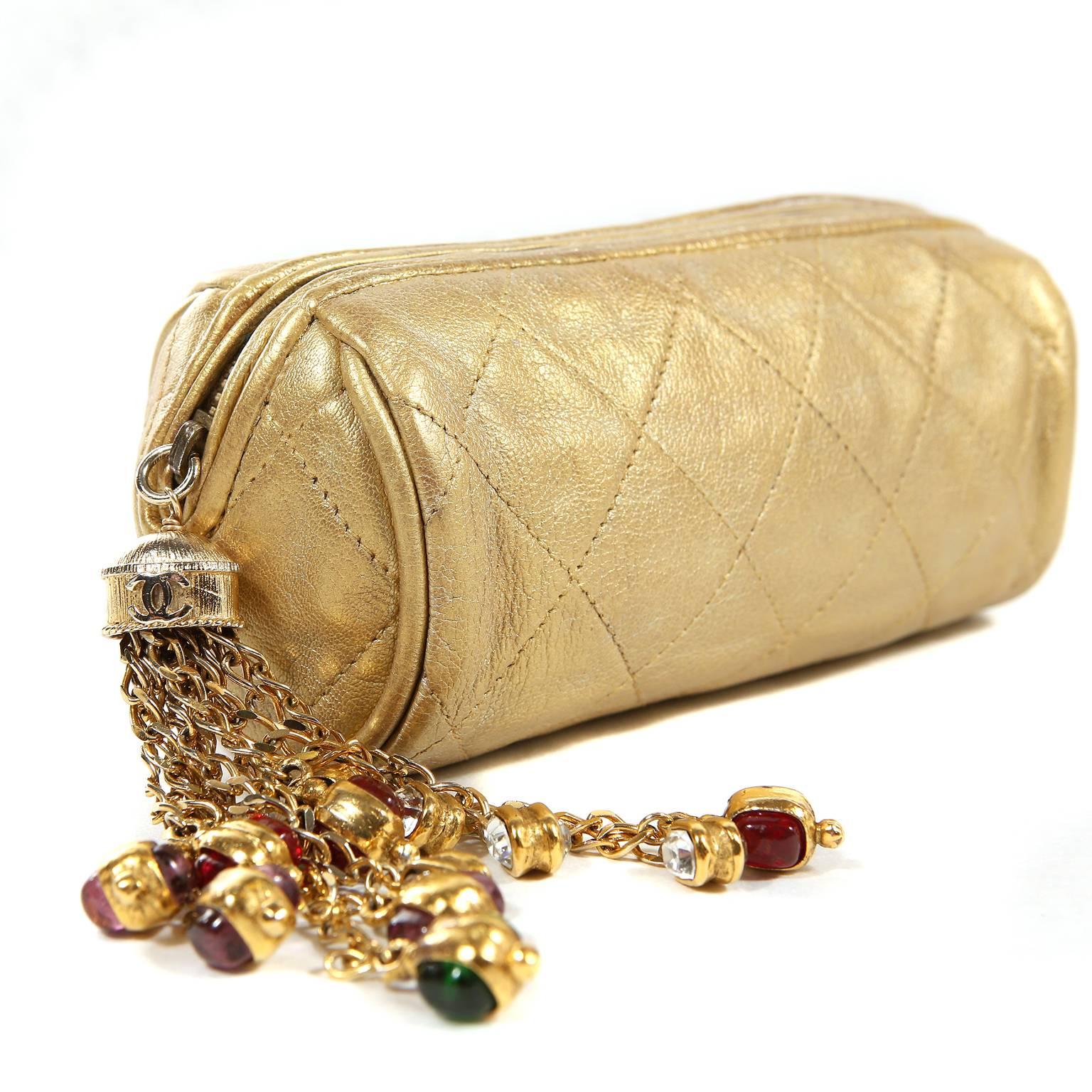 Chanel Gold Gripoix Tassel Evening Bag is in mint condition.  An early vintage piece, the Gripoix jeweled tassel makes this a rare and highly collectible Chanel. 
Soft metallic gold leather is quilted in signature Chanel diamond pattern.  Rounded