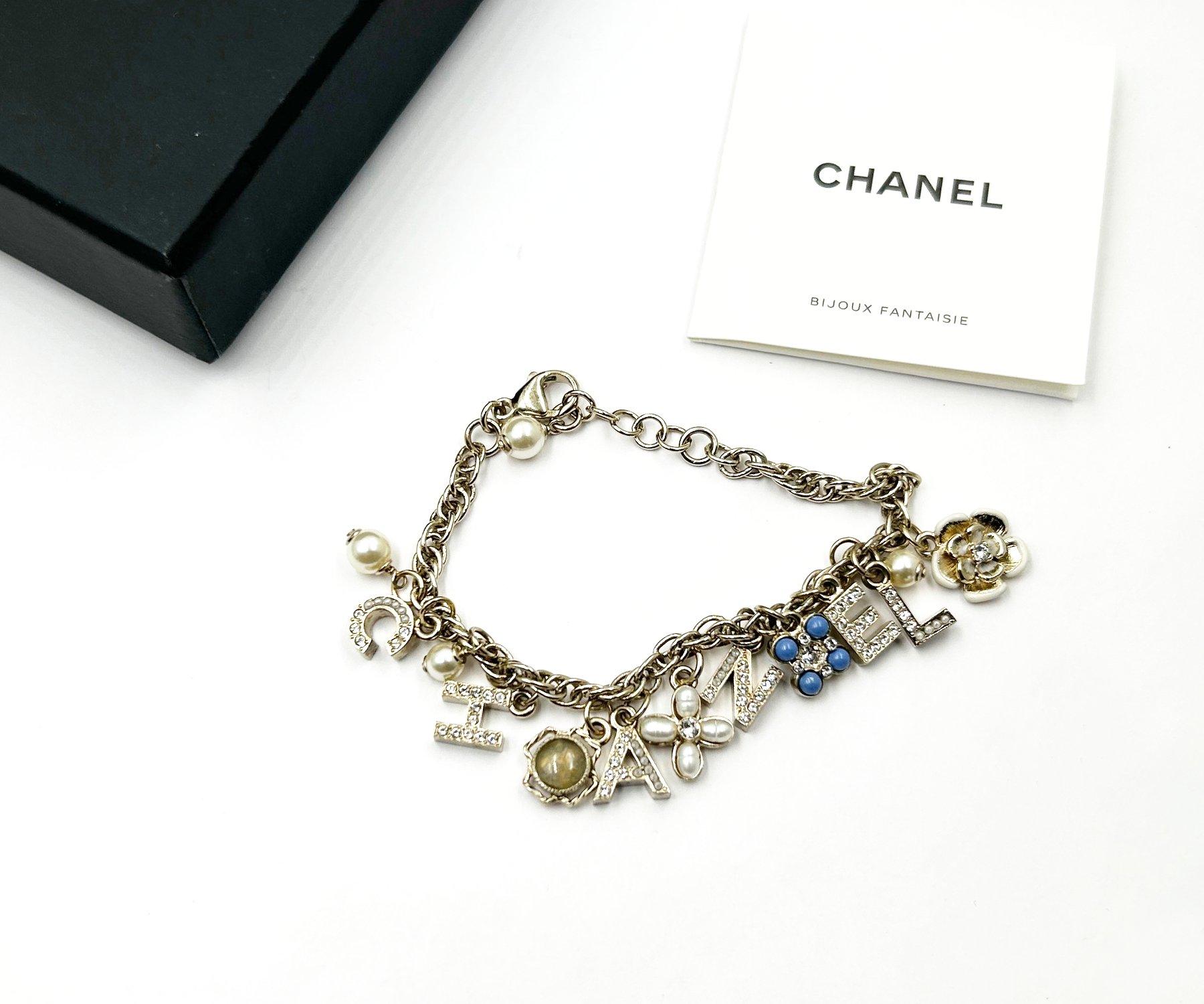 Artisan Chanel Gold Letter Clover Flower Motif Bracelet For Sale